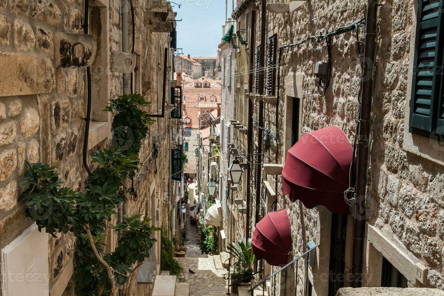 The beautiful steep alleys at the walled old town of Dubrovnik photo