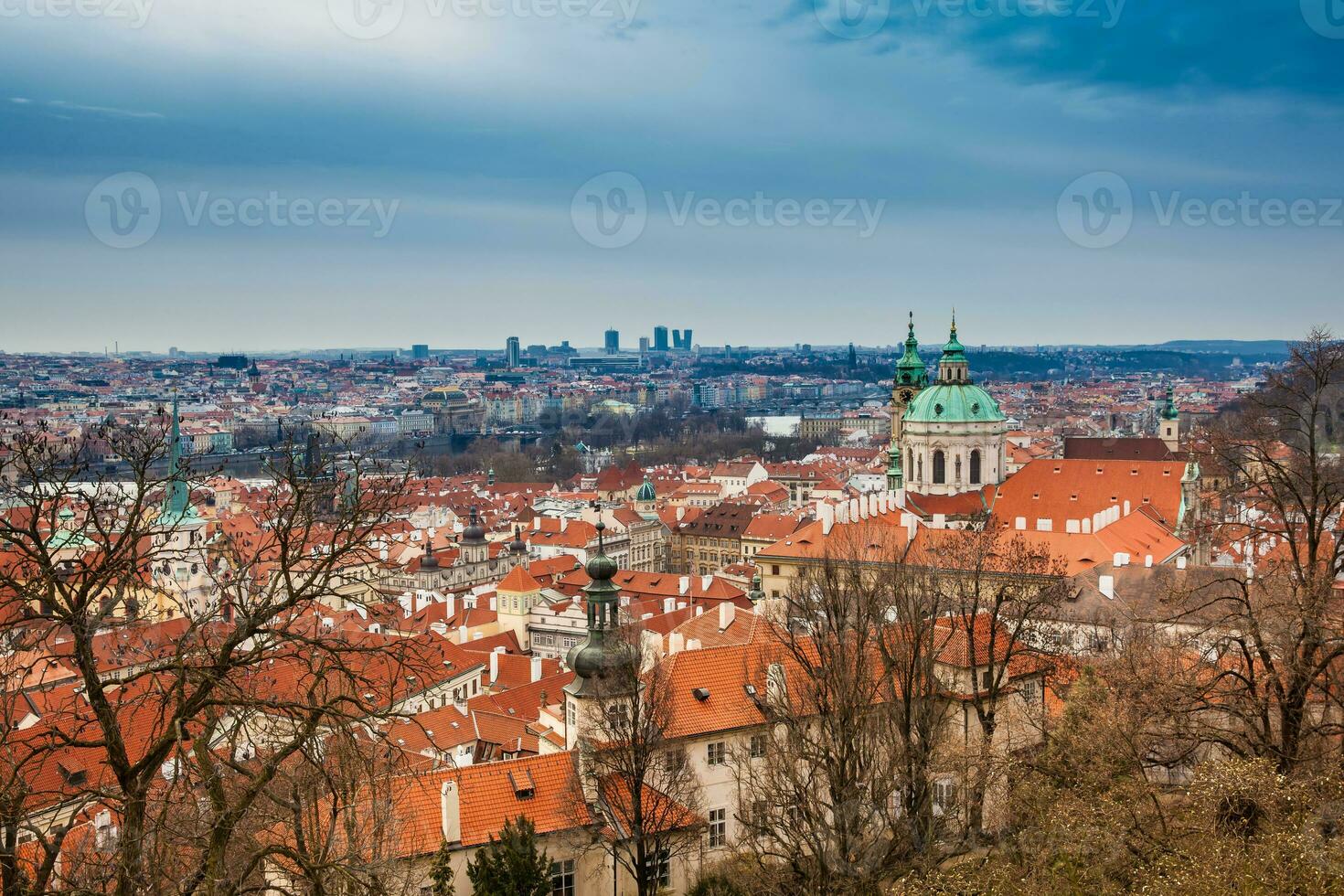 The beautiful Prague city old town seen form the Prague Castle viewpoint in an early spring day photo