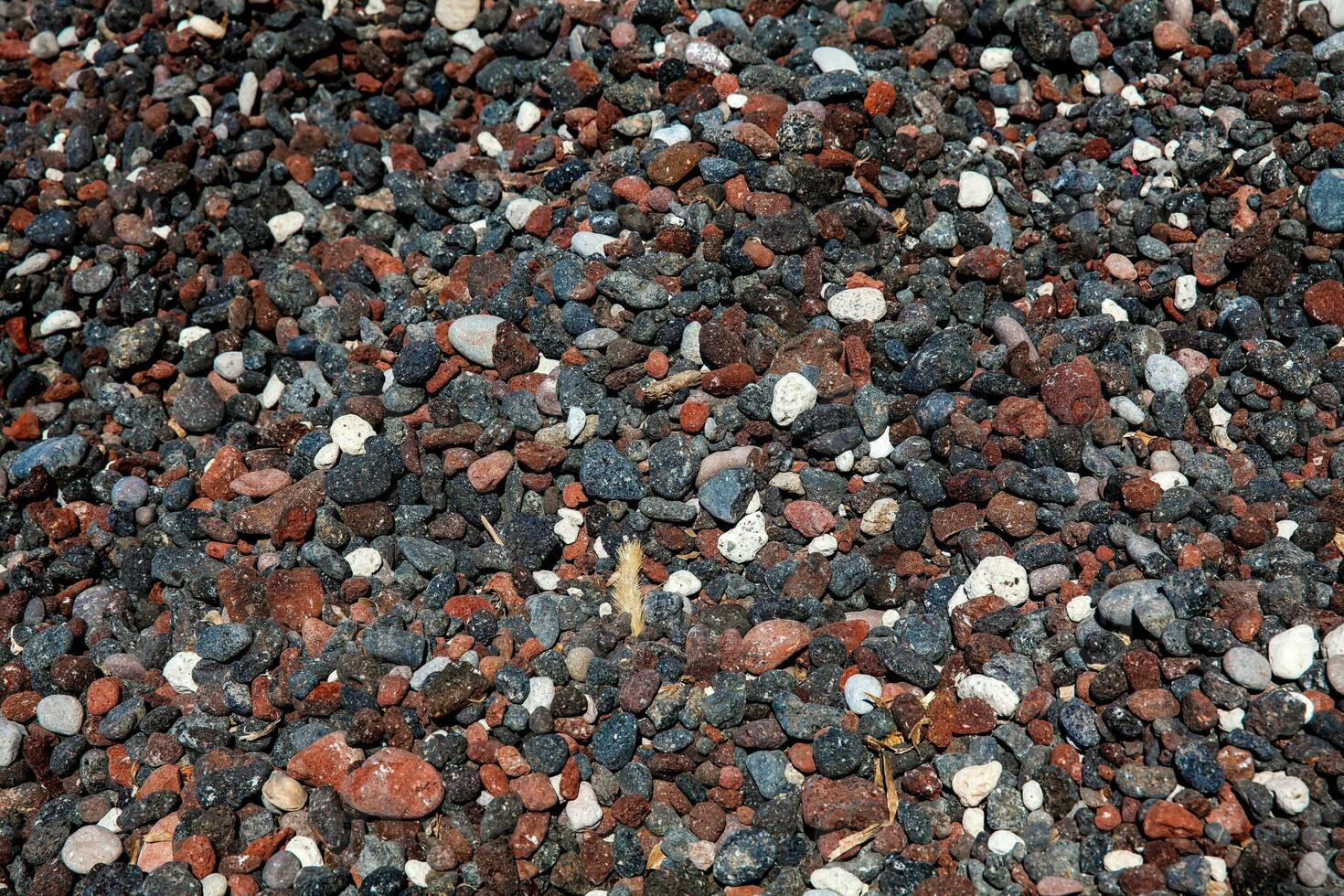 Detail of the rocks on the famous Red Beach at Santorini Island in a beautiful early spring day photo