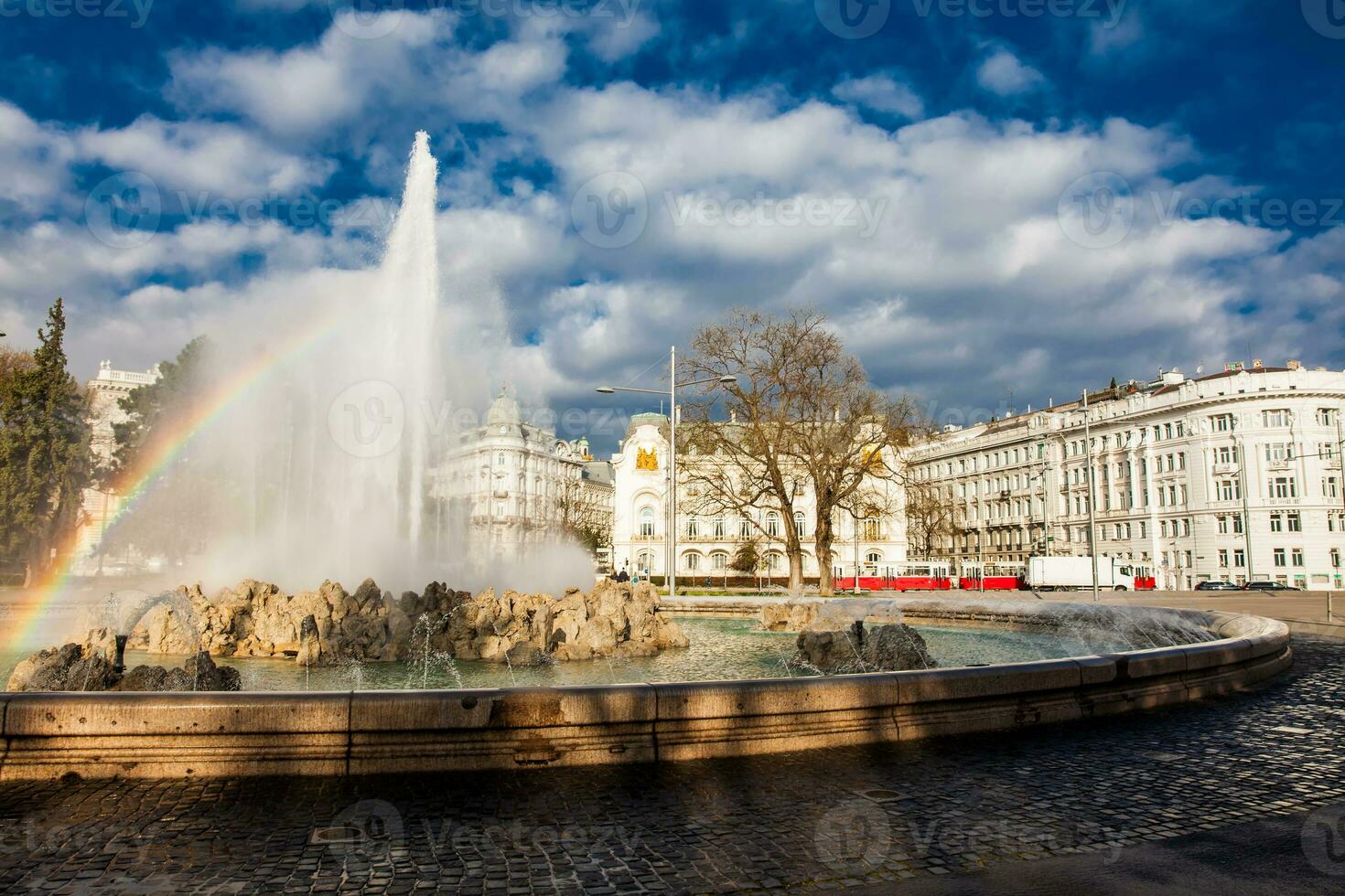 View of the beautiful buildings at Vienna city center and the fountain at Schwarzenbergplatz photo