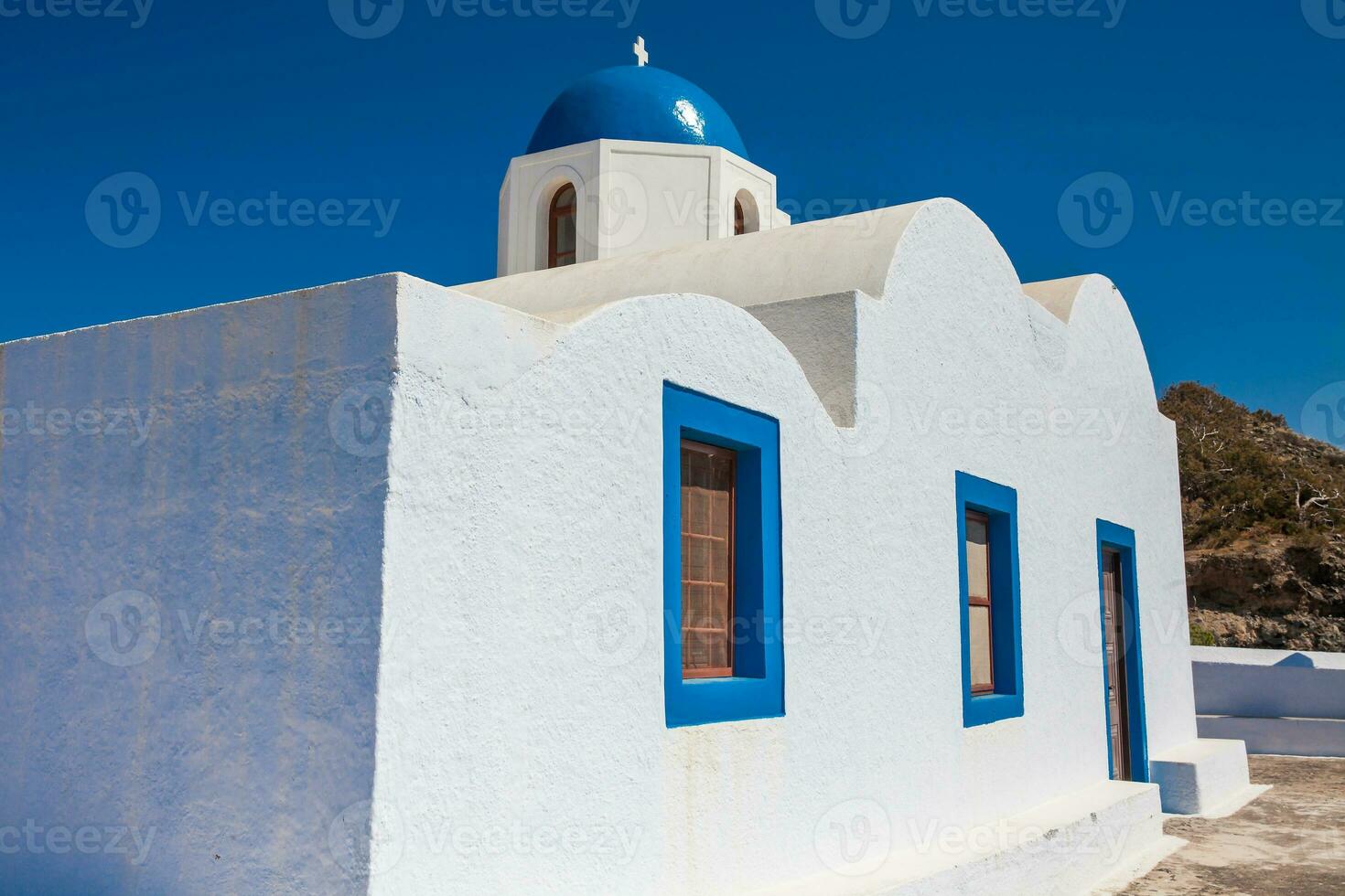 The Profitis Ilias church located next to walking path Number 9 between Fira and Oia in Santorini Island photo