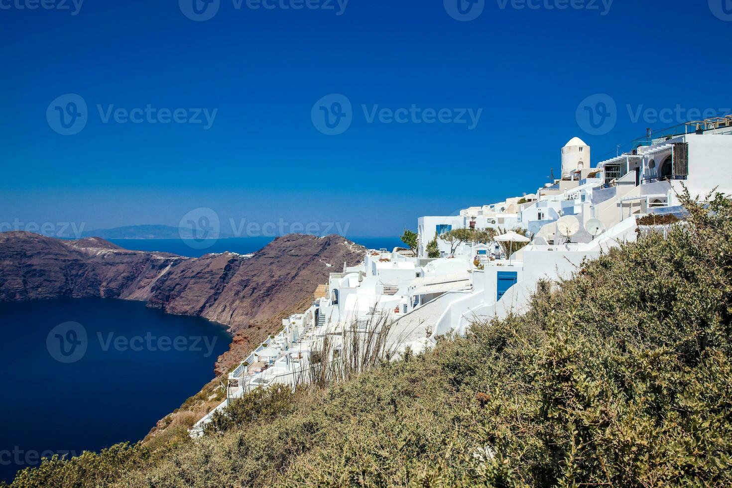 The beautiful Aegean Sea seen from the walking trail number 9 which connects the cities of Fira and Oia on the Santorini Island photo
