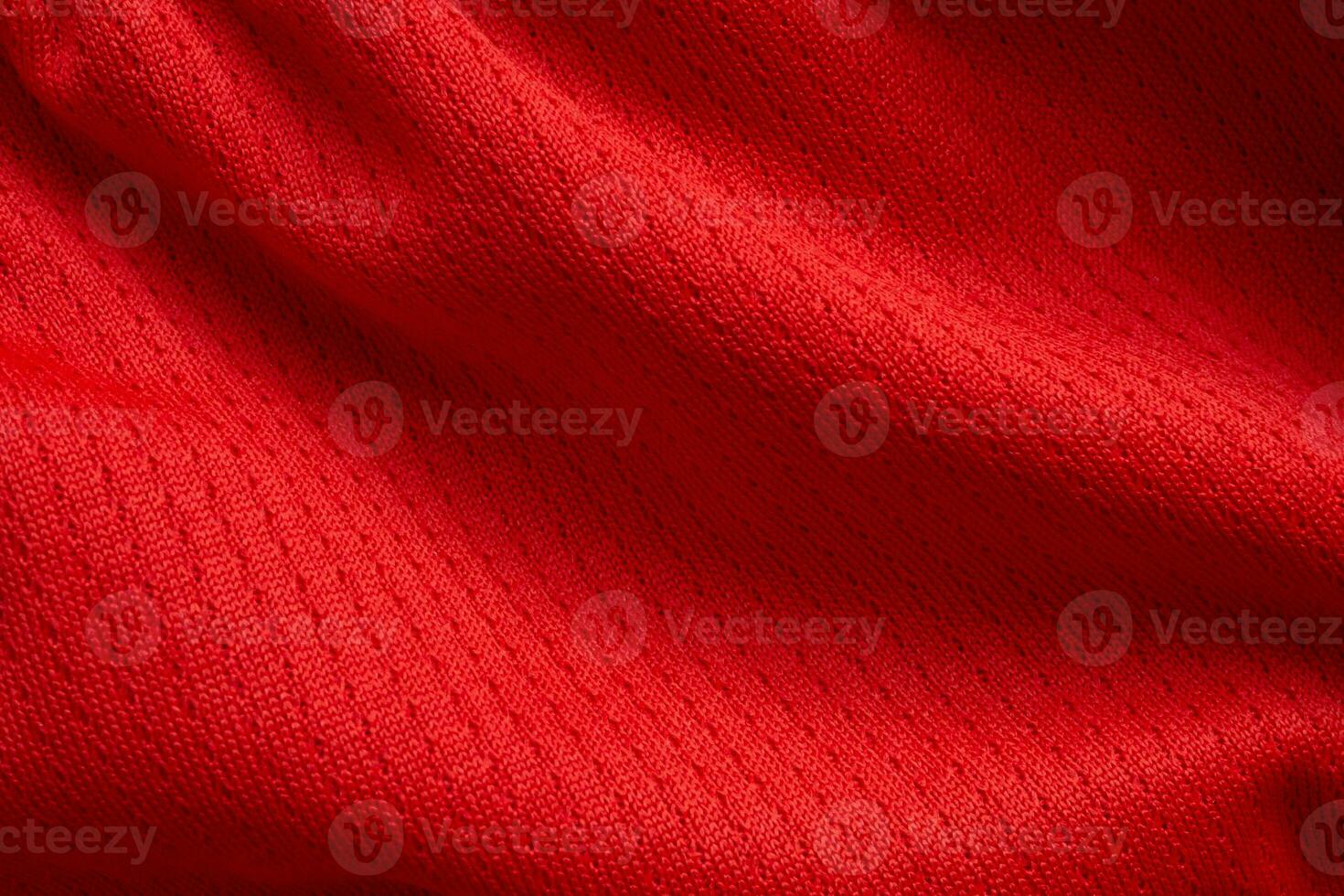 Fondo de textura de jersey de camiseta de fútbol de tela de ropa deportiva roja foto