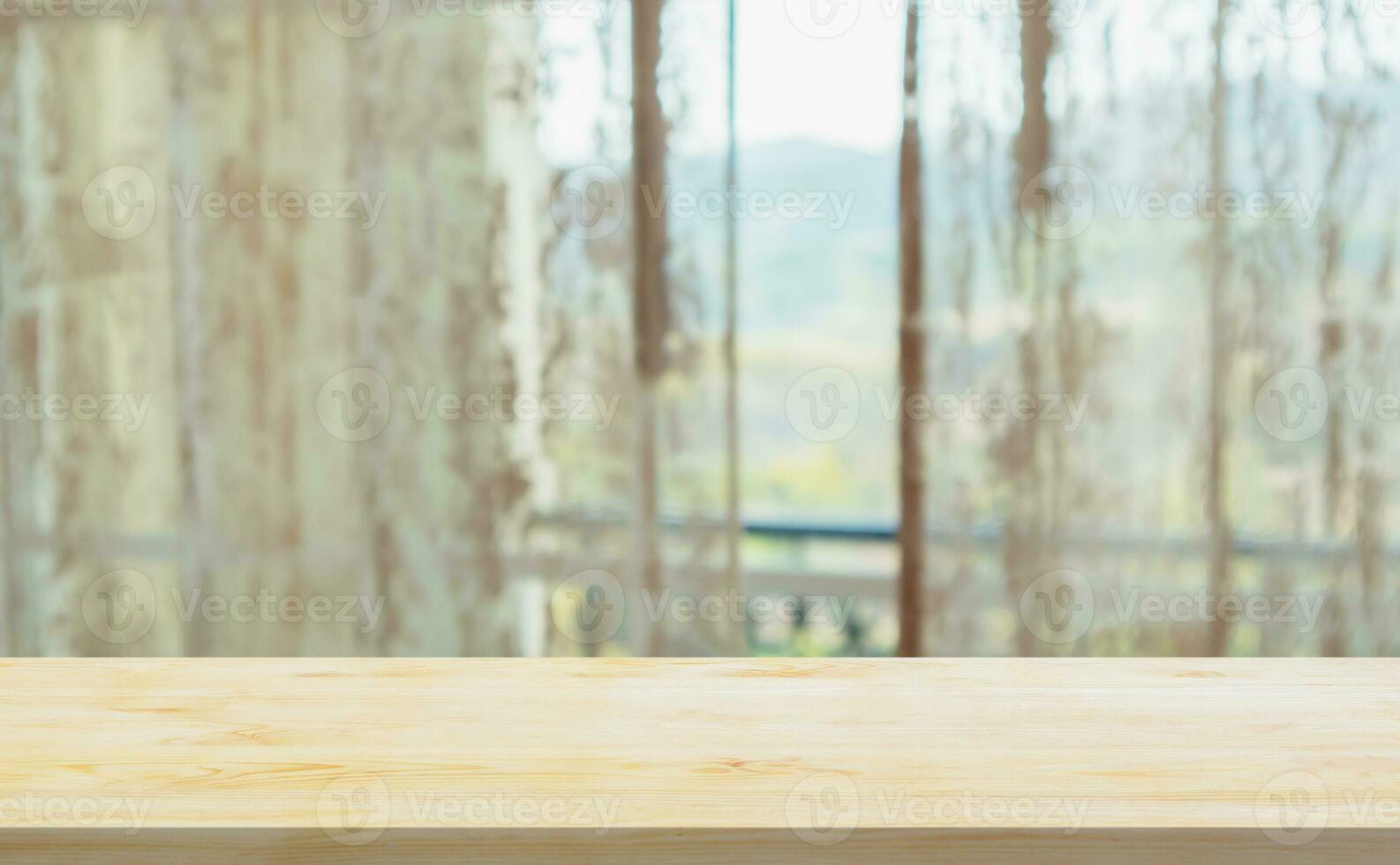 Empty wood table top with window curtain abstract blur background for product display photo