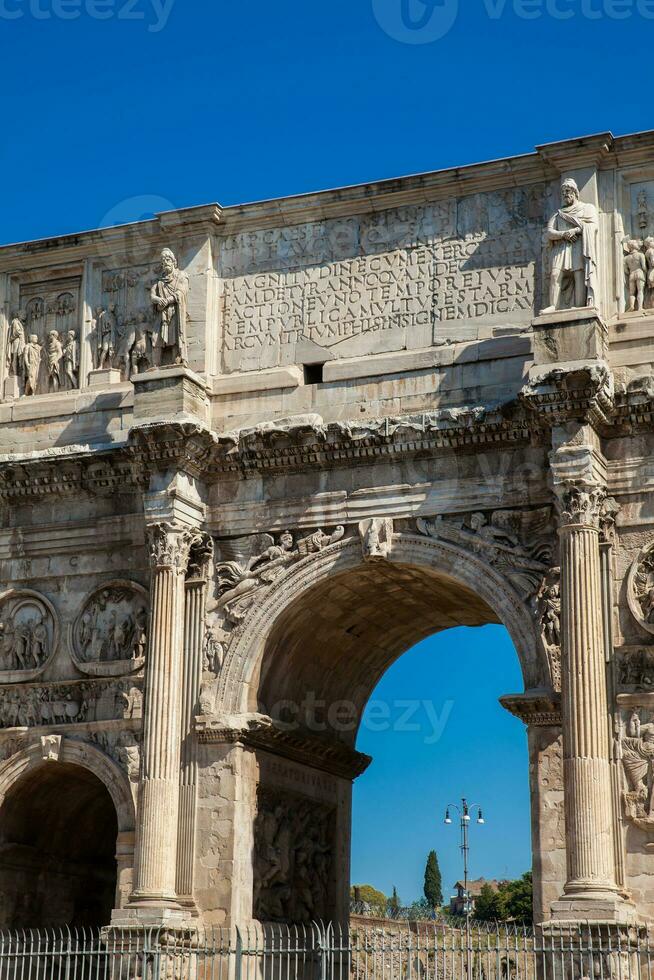 The Arch of Constantine a triumphal arch in Rome, situated between the Colosseum and the Palatine Hill built on the year 315 AD photo