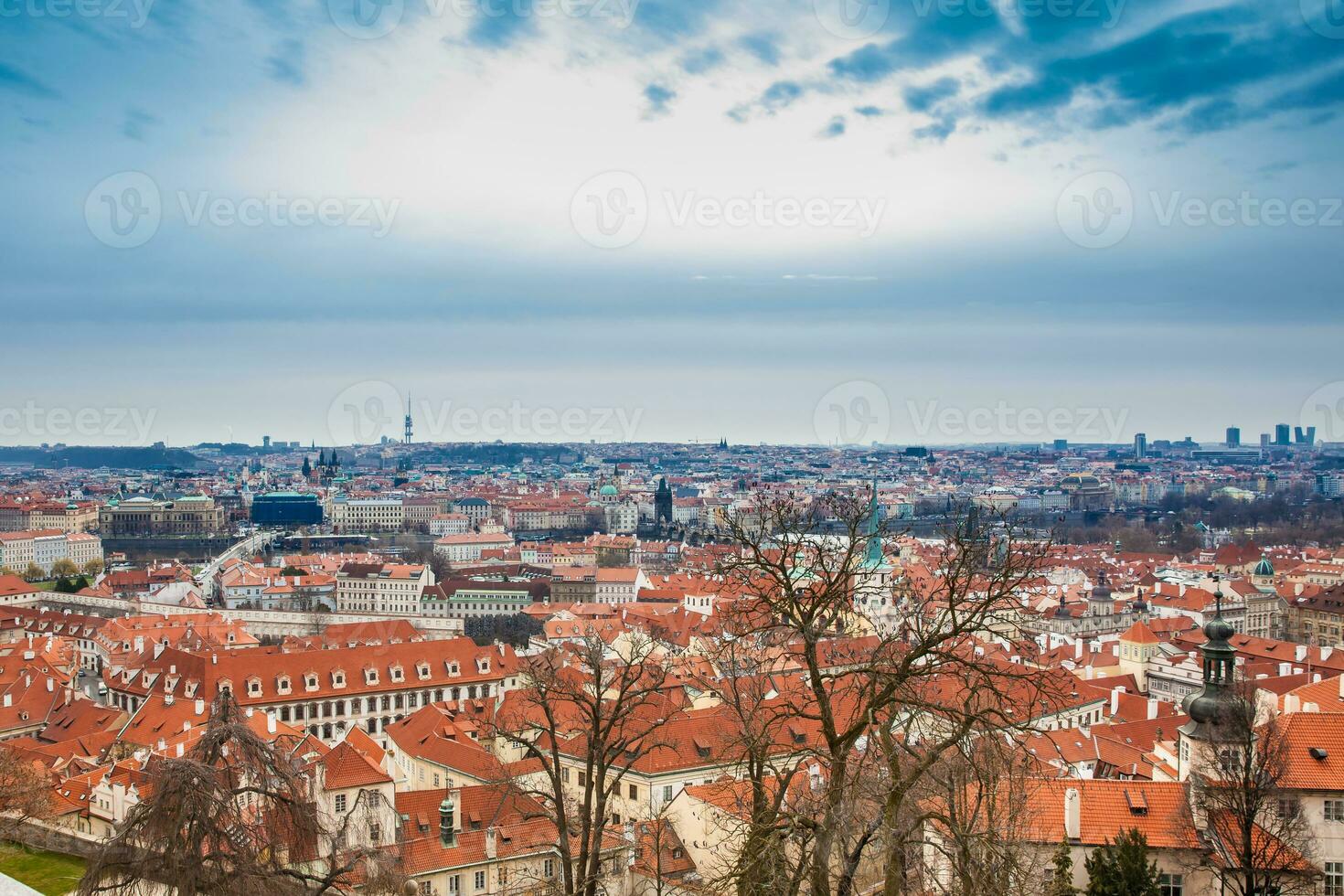 The beautiful Prague city old town seen form the Prague Castle viewpoint in an early spring day photo