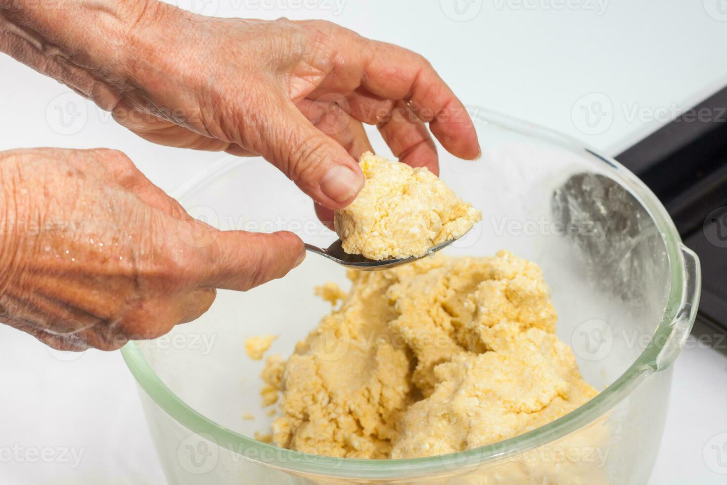Pandebono preparation. Form pandebono dough into medium sized balls photo