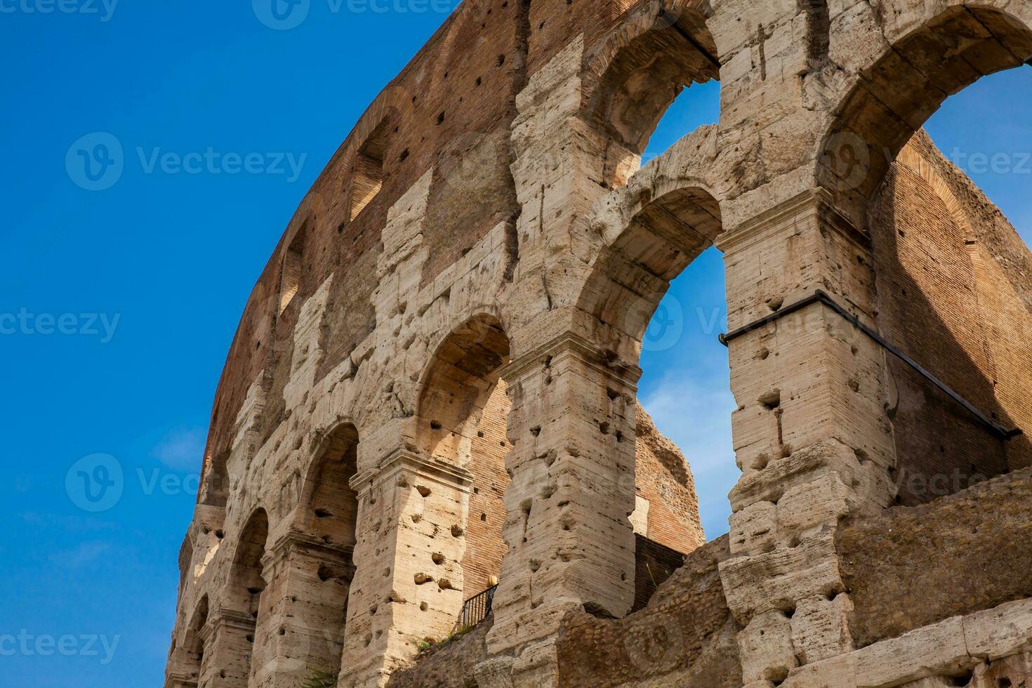 Detail of the  facade of the famous Colosseum or Coliseum also known as the Flavian Amphitheatre in the centre of the city of Rome photo