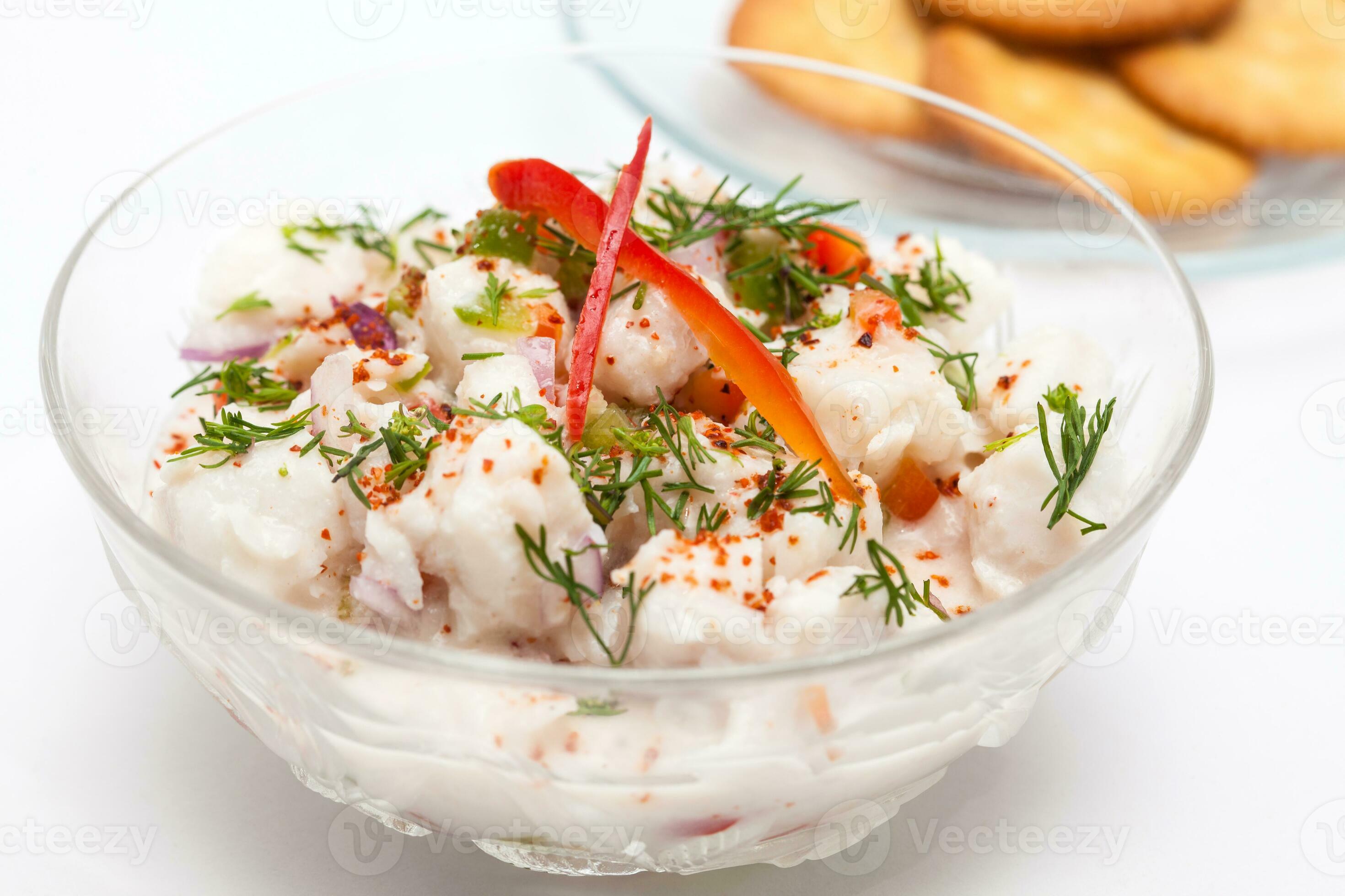 Peruvian ceviche preparation. White fish Peruvian ceviche served in a