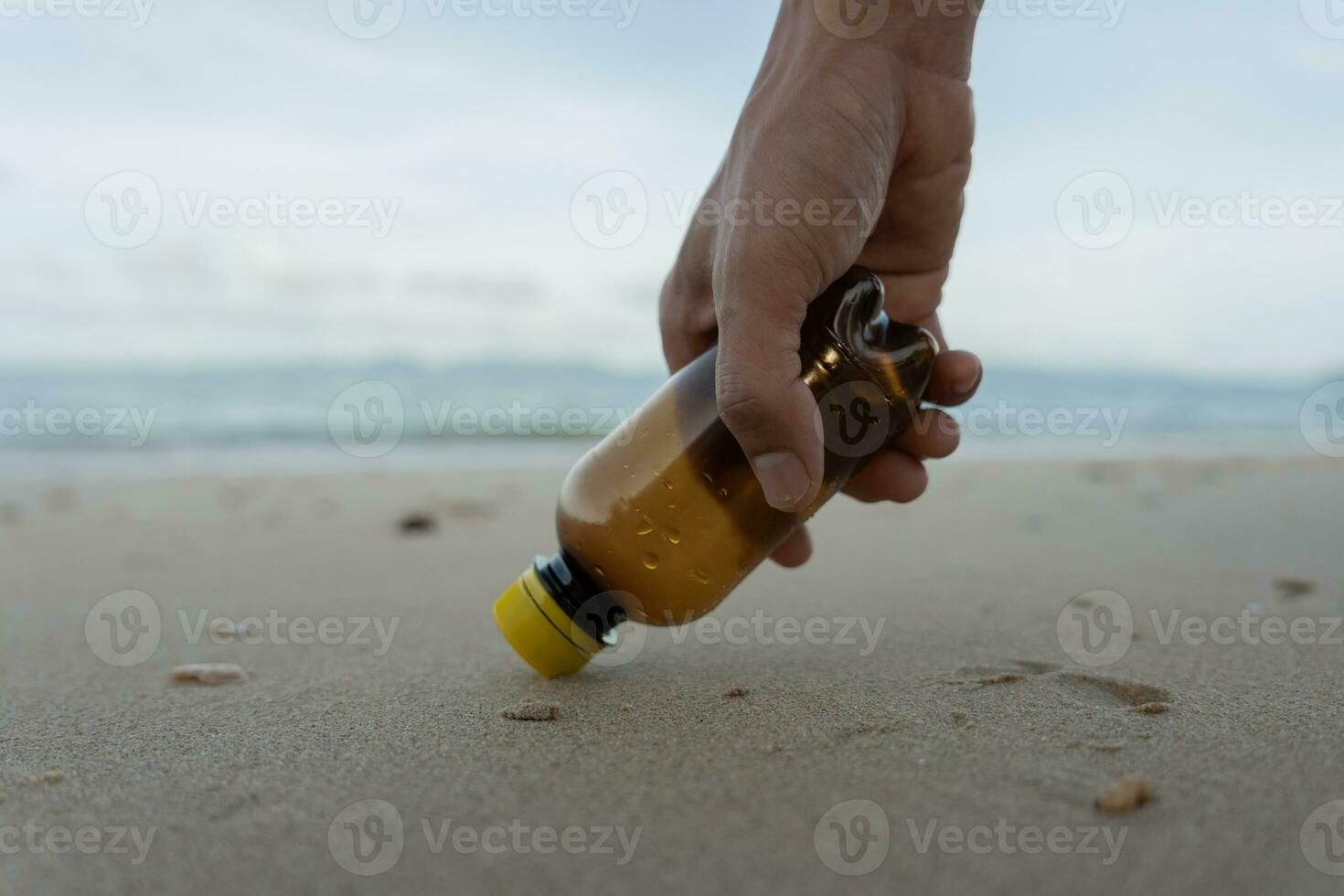 Save ocean. Volunteer pick up trash garbage at the beach and plastic bottles are difficult decompose prevent harm aquatic life. Earth, Environment, Greening planet, reduce global warming, Save world photo