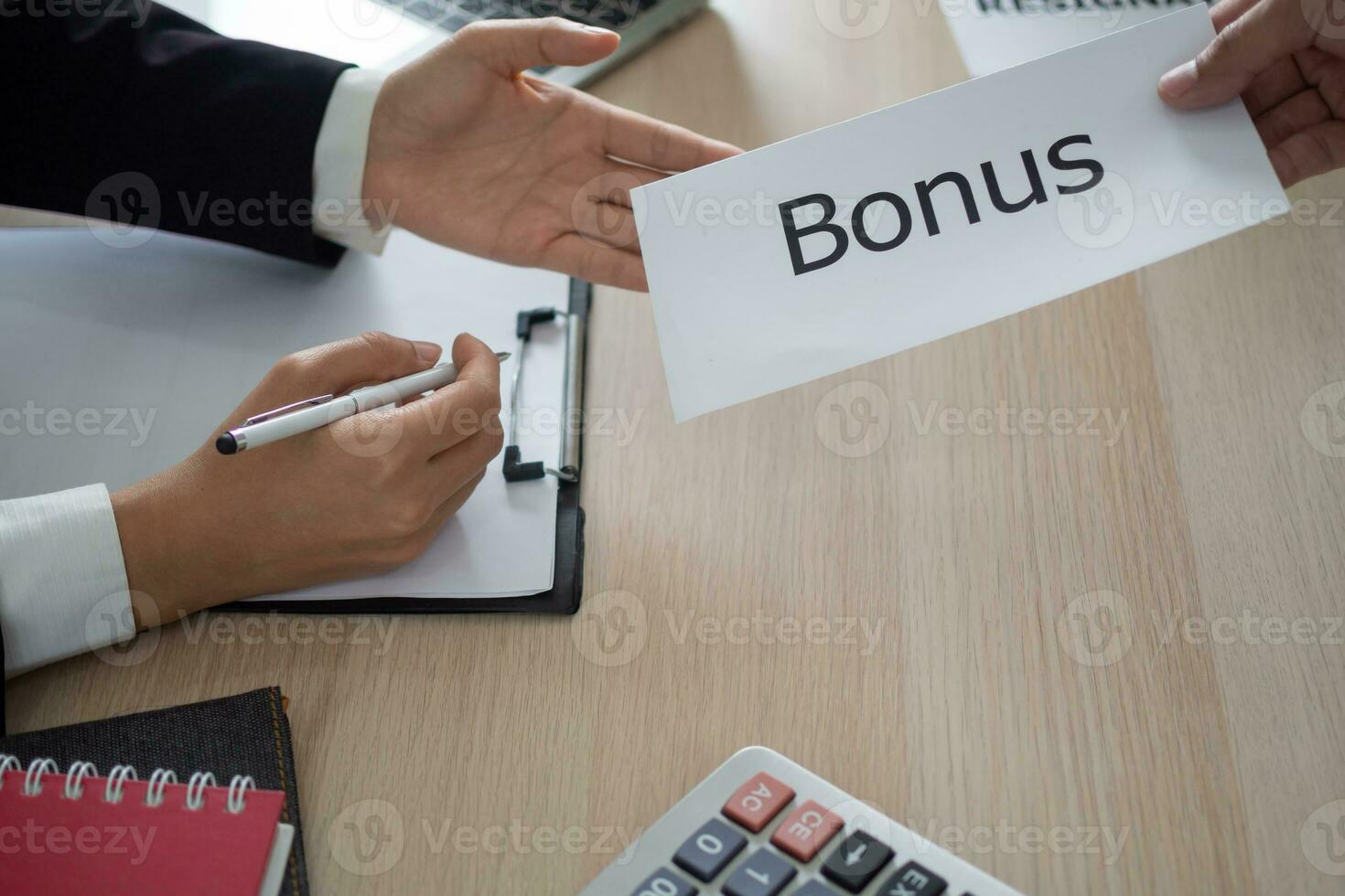 Businessmen receive salary or bonuses from management or Boss. Company give rewards to encourage work. Smiling businessman enjoying a reward at the desk in the office. photo