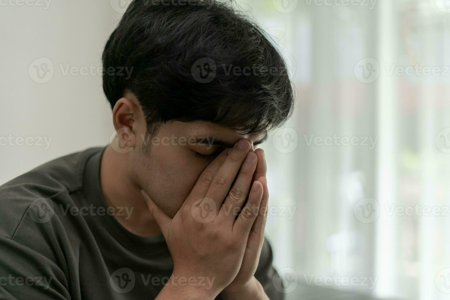 Depression and mental illness. Asian man disappoint, sad after receive bad news. Stressed boy confused with unhappy problem, arguing with girlfriend, cry and worry about unexpected work, down economy. photo