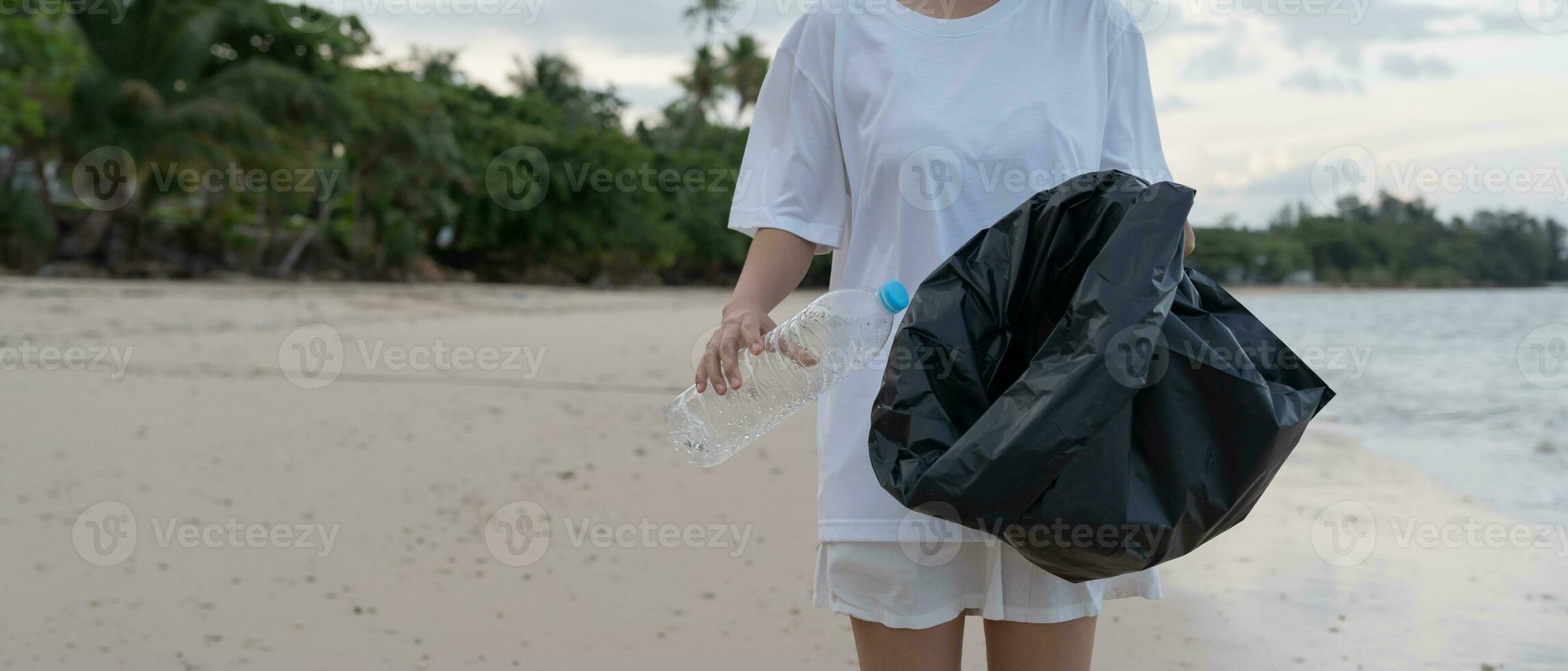 Save water. Volunteer pick up trash garbage at the beach and plastic bottles are difficult decompose prevent harm aquatic life. Earth, Environment, Greening planet, reduce global warming, Save world photo