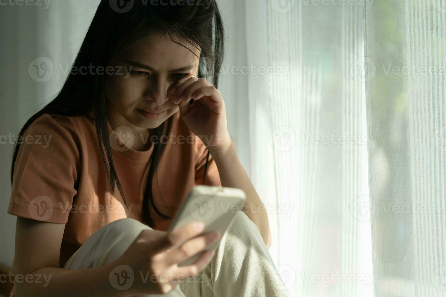 Depression and mental illness. Asian woman disappointed, sad after receiving bad news. Stressed girl confused with unhappy problems, arguing with boyfriend, cry and worry about unexpected pregnancy. photo
