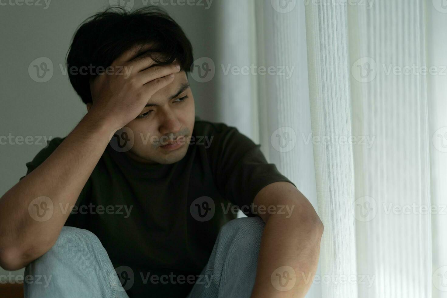 Depression and mental illness. Asian man disappoint, sad after receive bad news. Stressed boy confused with unhappy problem, arguing with girlfriend, cry and worry about unexpected work, down economy. photo