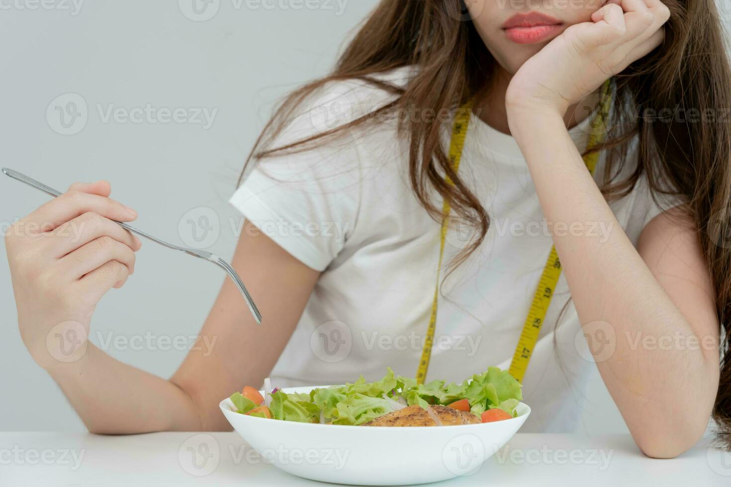 slim body asian women very bored diet food, dieting female choose low calories food for diet. Good healthy food. weight lose, balance, control, reduce fat, routines, exercise, body shape photo