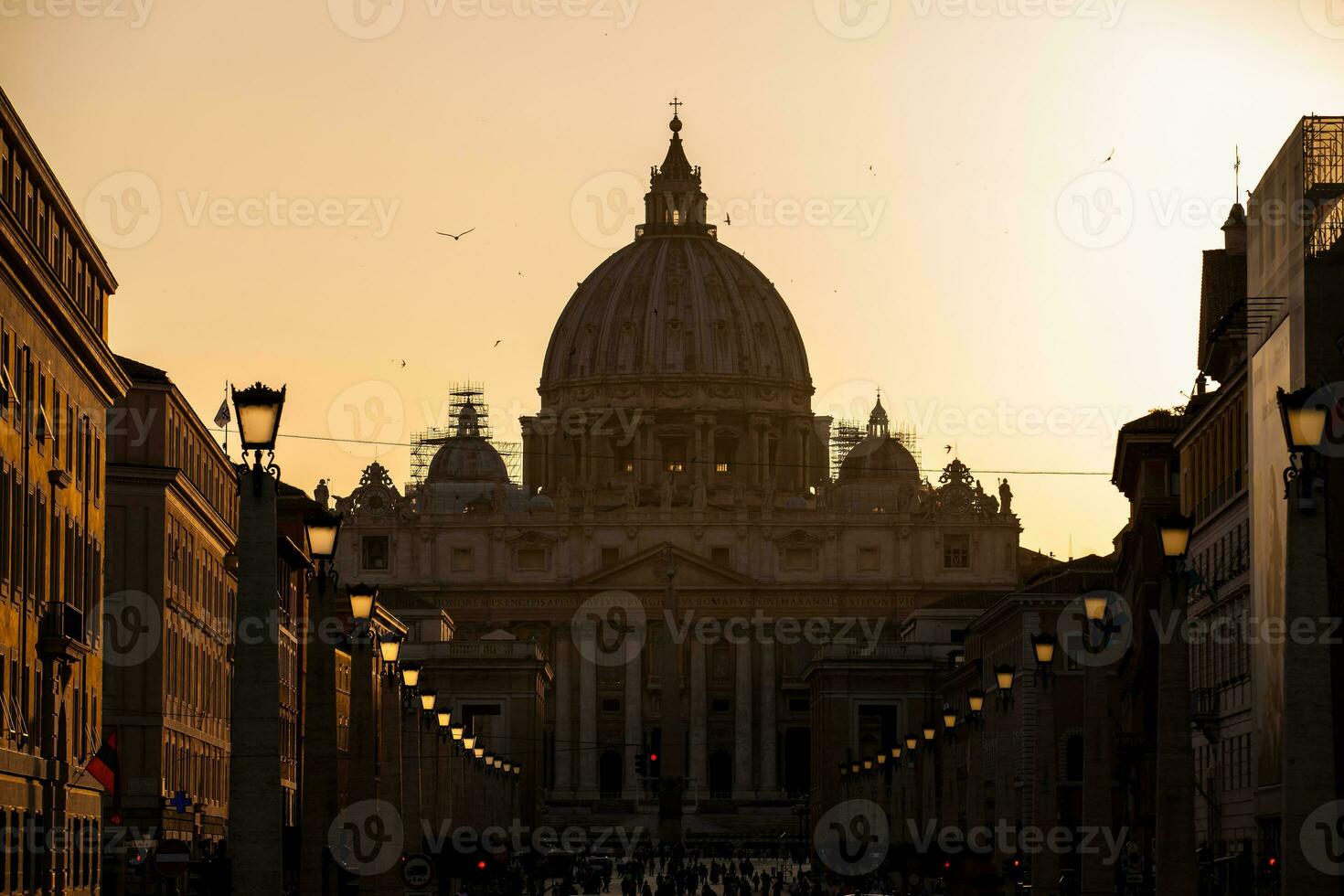 The sunset falls over the beautiful Constantinian Basilica of St. Peter at the Vatican City photo