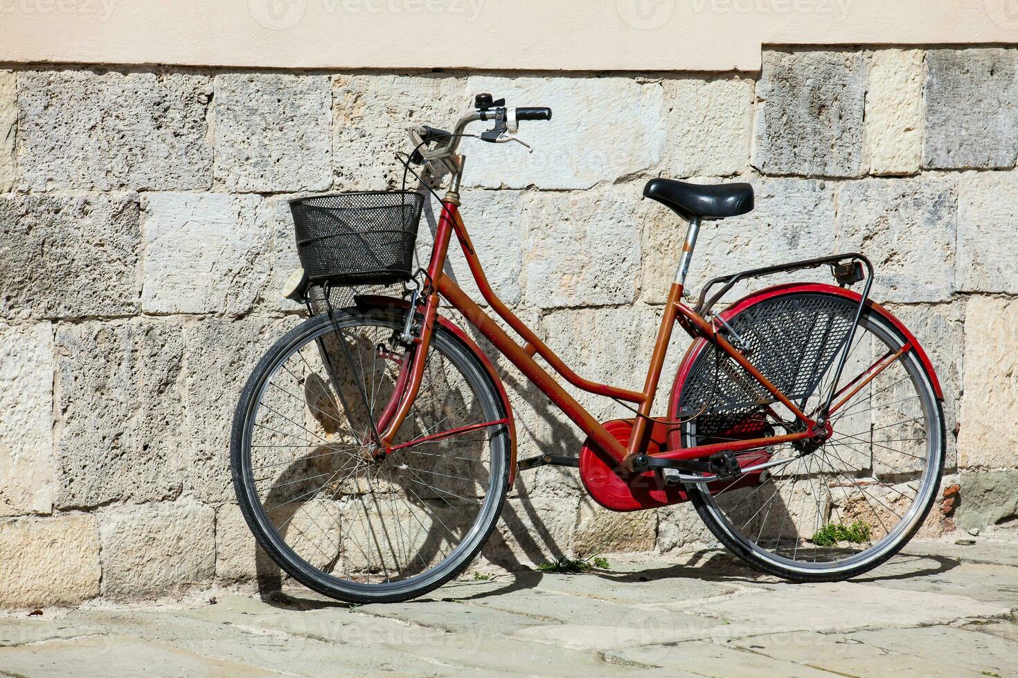 Parked bicycle at the beautiful streets of Pisa photo