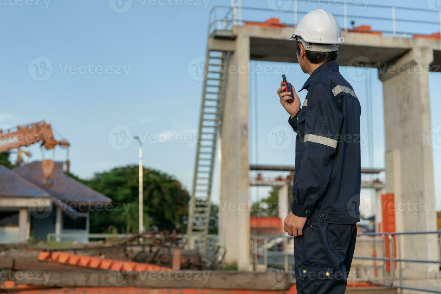 maintenance and inspector. Maintenance engineers are using walky talky to inform the results of inspection of buildings and structures. Irrigation engineers are exploring sluice systems photo