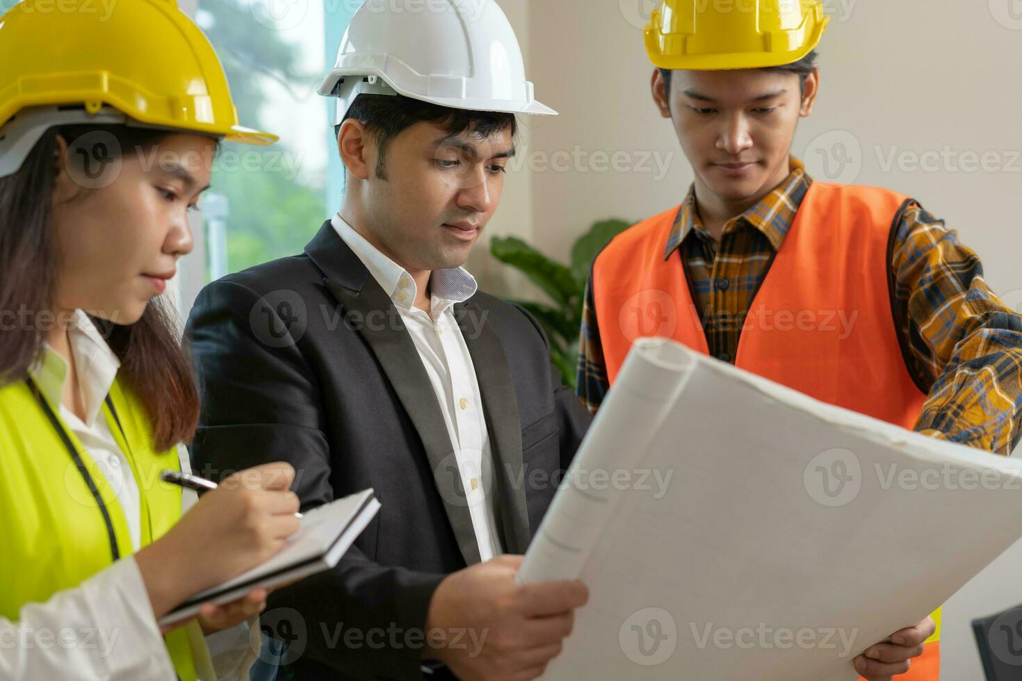 Engineers team and owner discuss check and review the blueprint of construction. Contractor inspection drawing before start project civil. project planning, consulting, architecture. photo