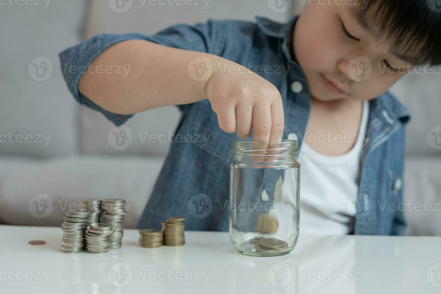 Save money. children putting coin for saving. wealth, Finance, insurance, investment, education, future, plan life, learn, banking, family, health, health and accident insurance. photo