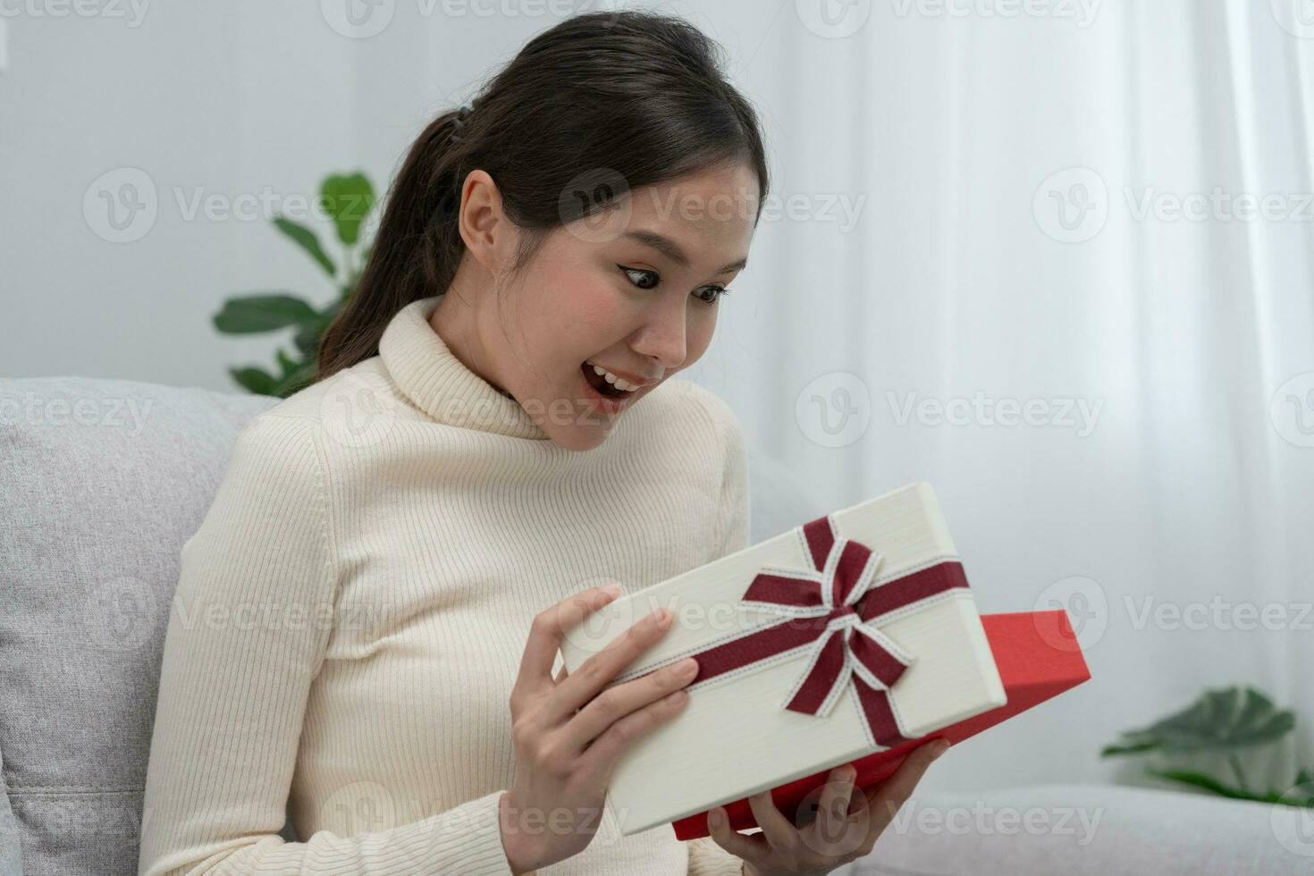 Pretty asian woman feel surprise and look interest inside shopping box. cute girl excited open gift box. birthday, Celebration, xmas, New year Festival, thank, Celebrate, Valentine's Day, Anniversary photo