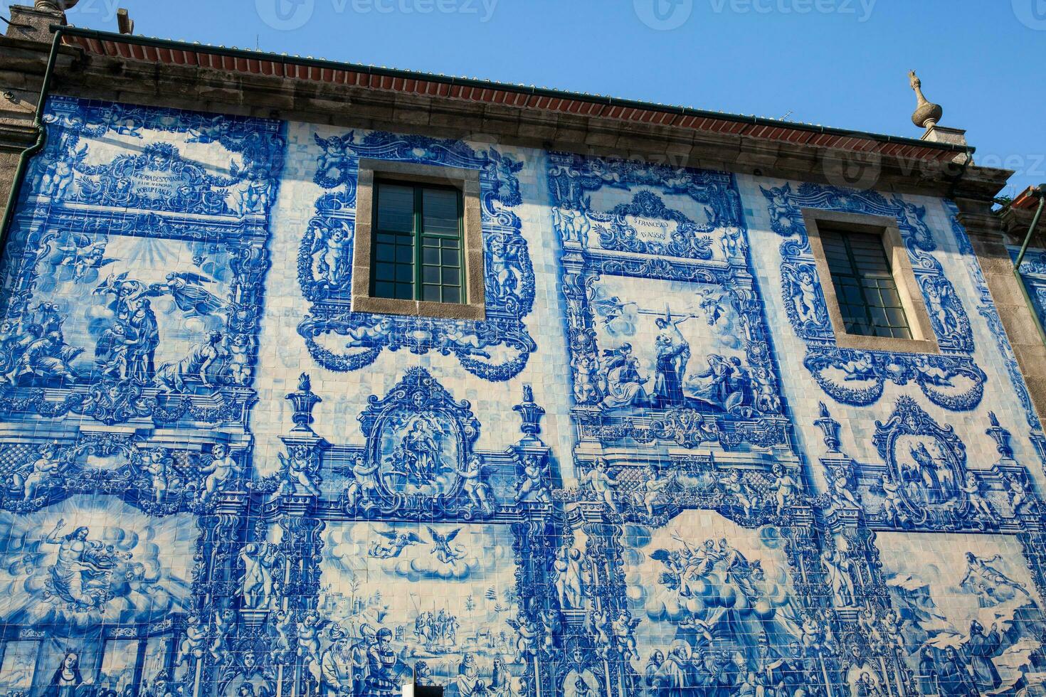 Beautiful antique wall of the Chapel of Souls of Santa Catarina decorated with traditional portuguese azulejos photo