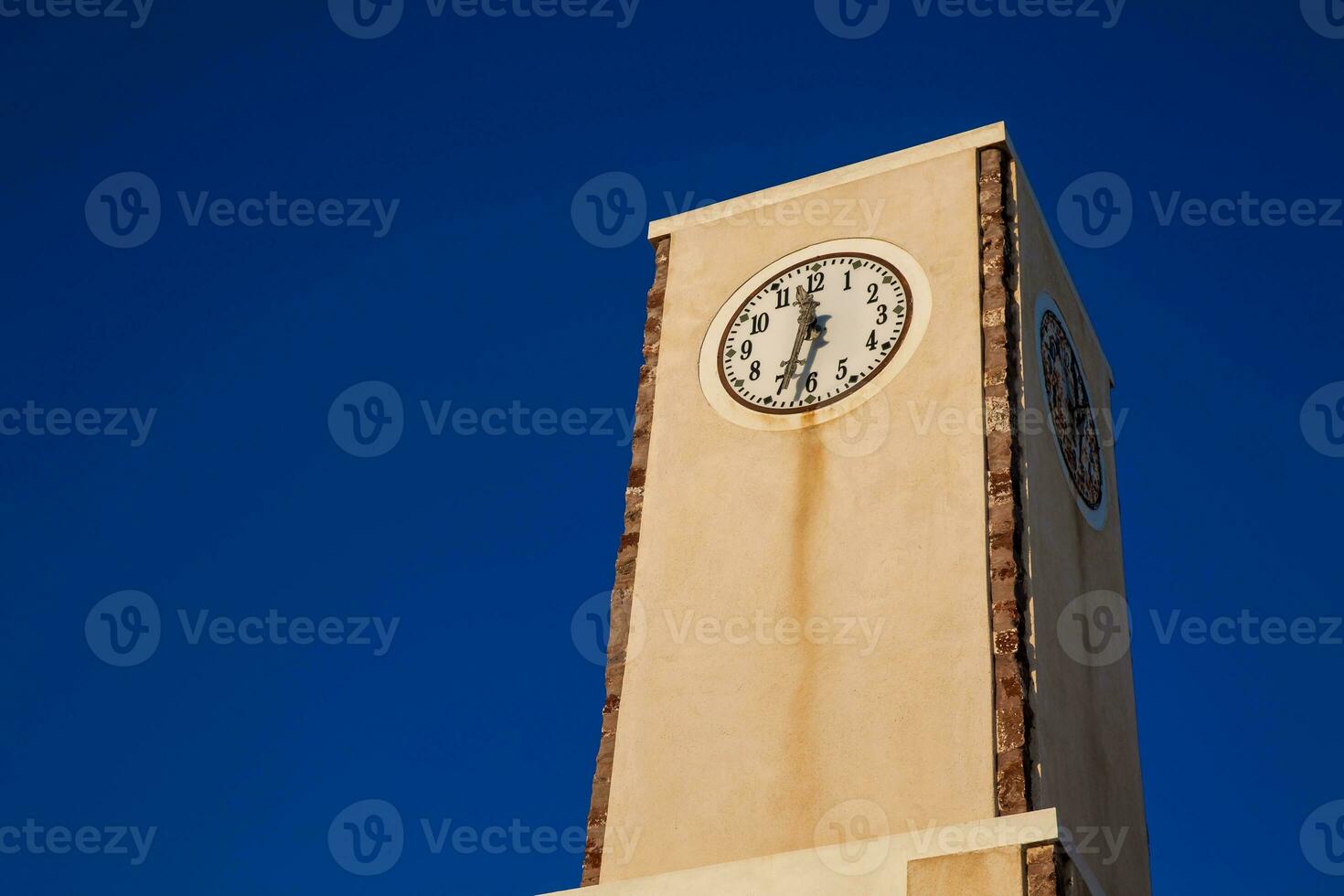Clock tower at Oia city in the Santorini Island photo