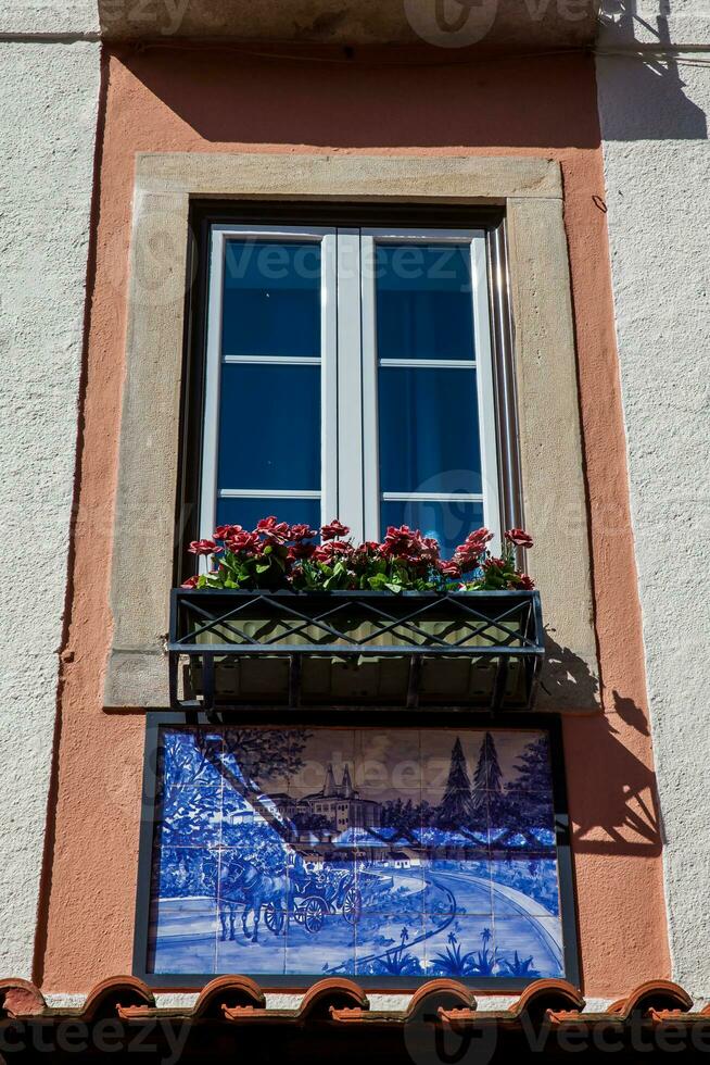 Beautiful window decorated with traditional Portuguese azulejos photo