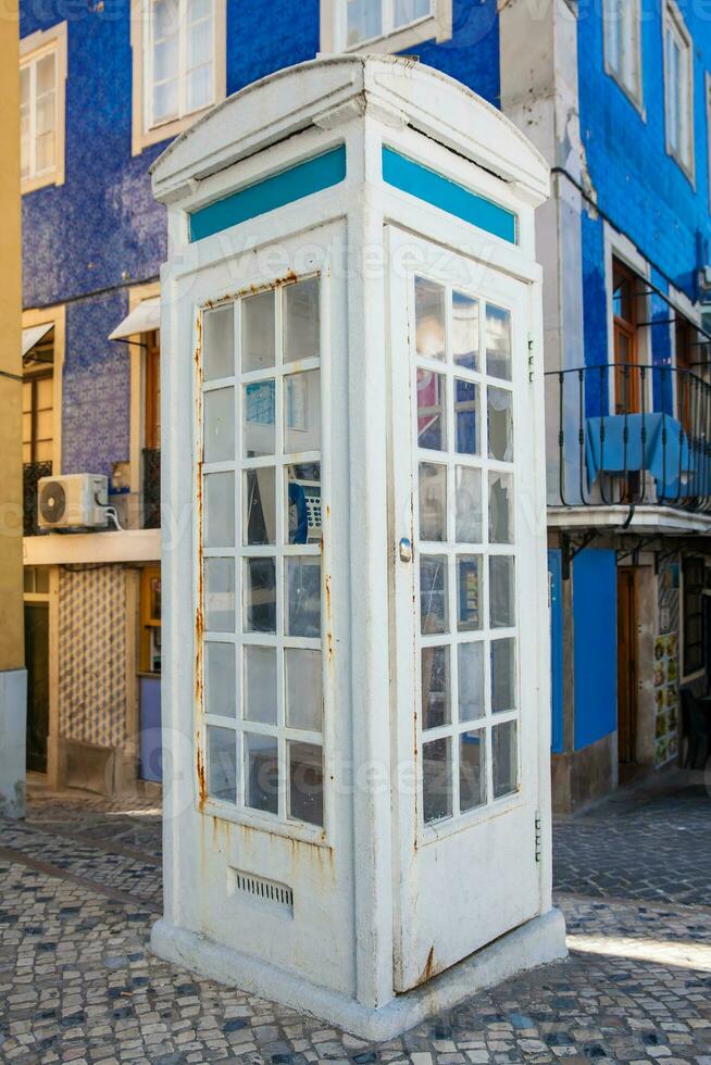 White vintage phone booth at a corner in Sintra photo