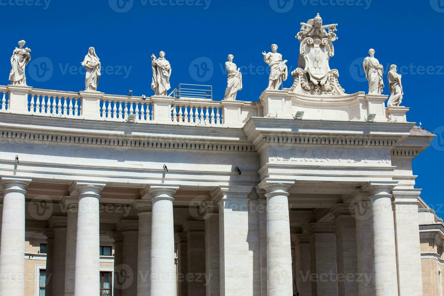 Detail of the Chigi coats of arms and the statues of saints that crown the colonnades of St. Peter Square built on 1667 on the Vatican City photo