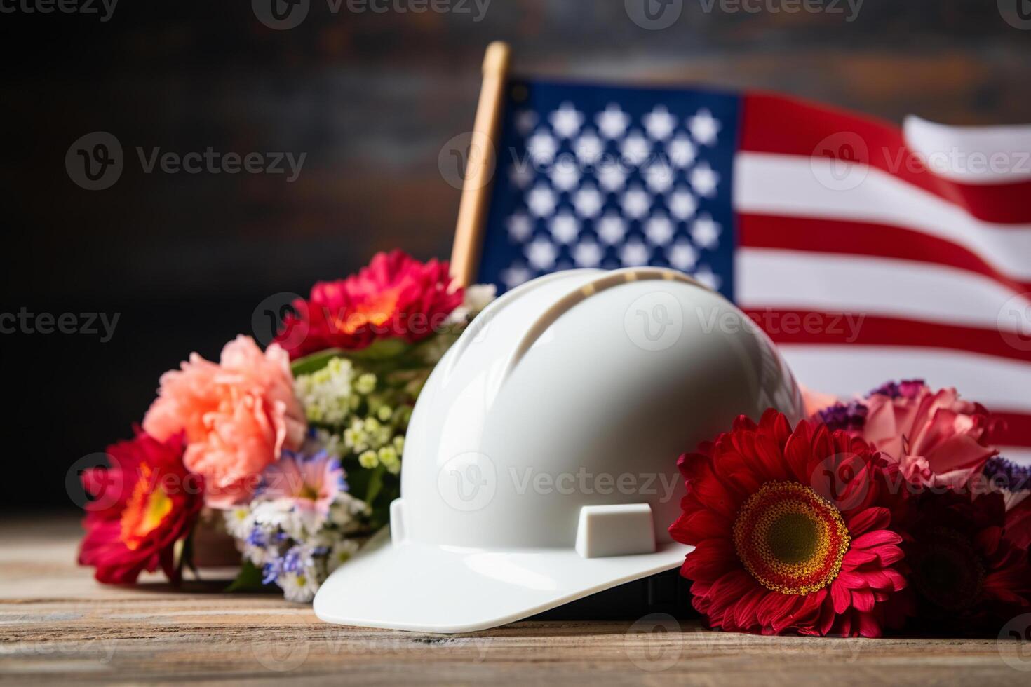 Helmet with American flag and flowers on wooden background. Labor day concept photo