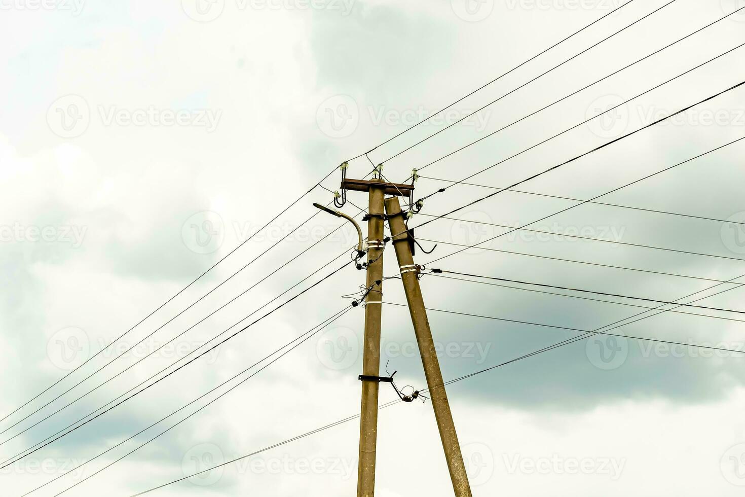 Power electric pole with line wire on colored background close up photo
