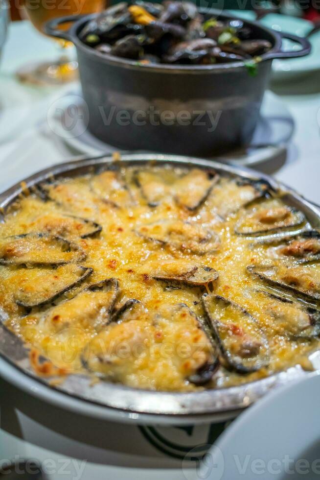 Traditional Belgian steamed mussels, mussels with cheese photo