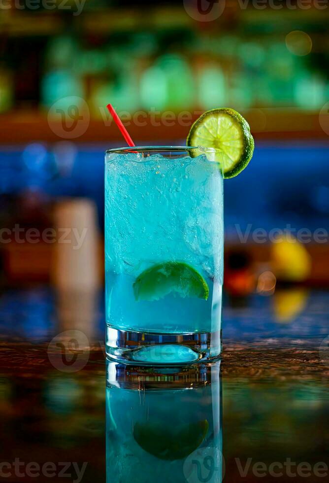 Cocktail blue maratita, Blue Hawaiian or blue cocktails with Lime slices on the edge of the glass on a bar in a restaurant photo