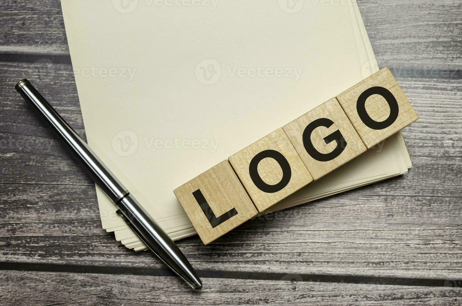 logo. wooden blocks on brown wooden background photo