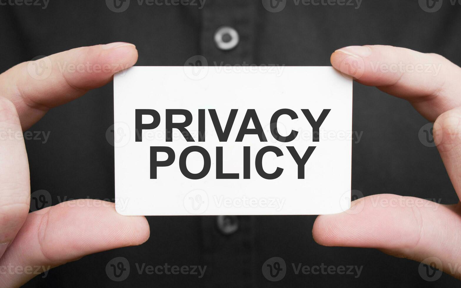 Businessman holding a card with text PRIVACY POLICY ,business concept photo