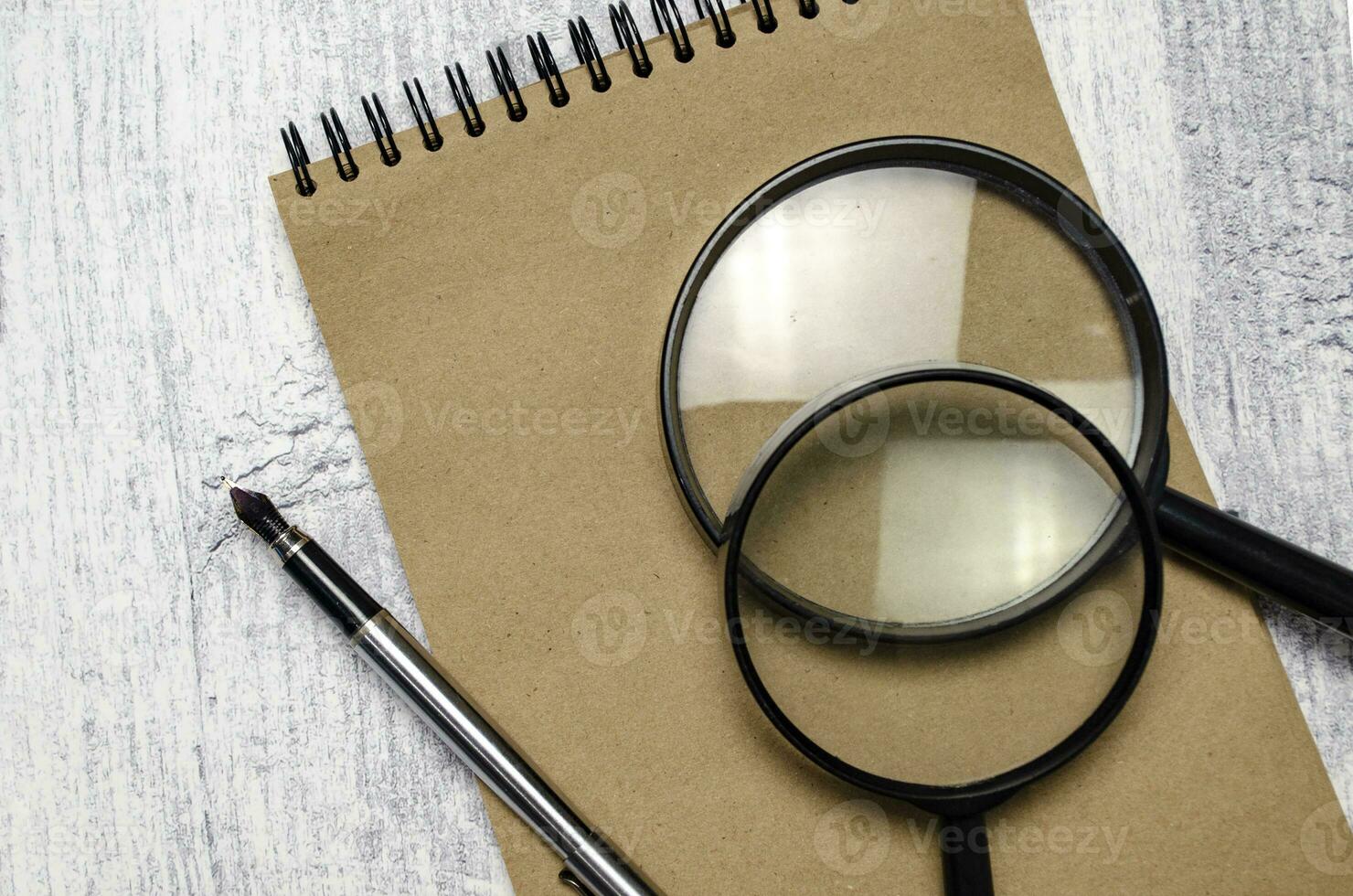Office supplies with documents close up and wooden background photo