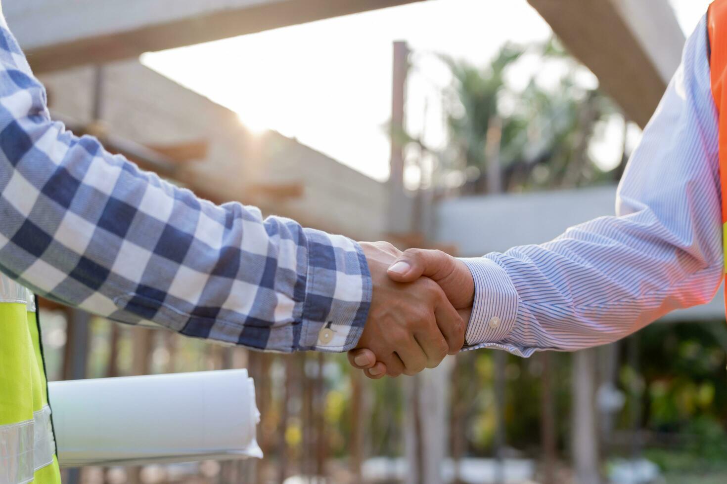 Construction worker team hands shaking greeting start up plan new project contract in office center at construction site, industry ,architecture, partner, teamwork, agreement, property, contacts. photo