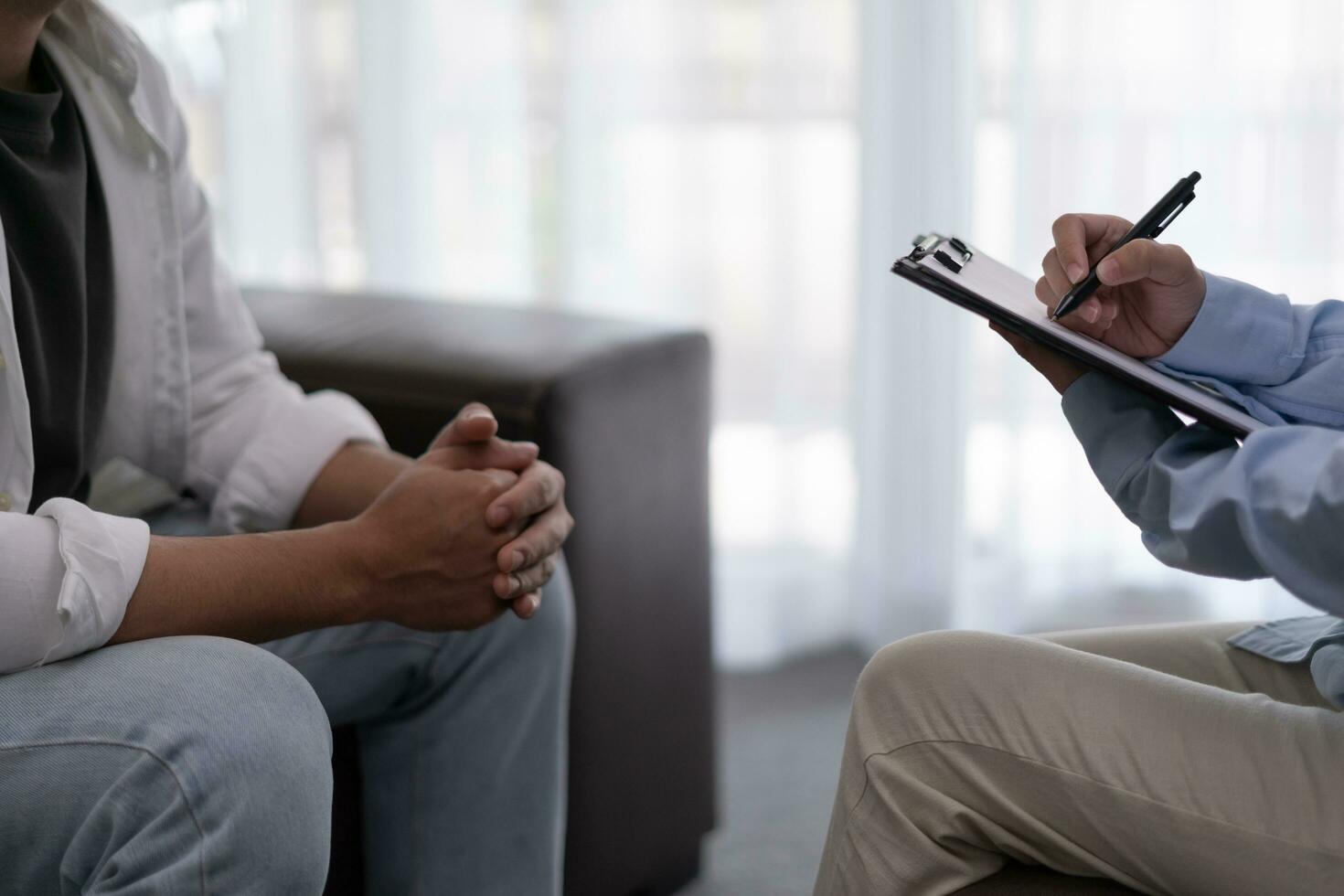 man with mental health problems is consulting. psychiatrist is recording the patient's condition for treatment. encouragement, love and family problem, bipolar , depression patient, protect suicide photo