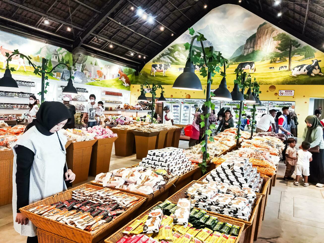 Cepogo, Boyolali, Indonesia - April 29, 2023. The atmosphere of visitors at the hawker center and souvenirs at Cepogo Cheese Park Boyolali. photo