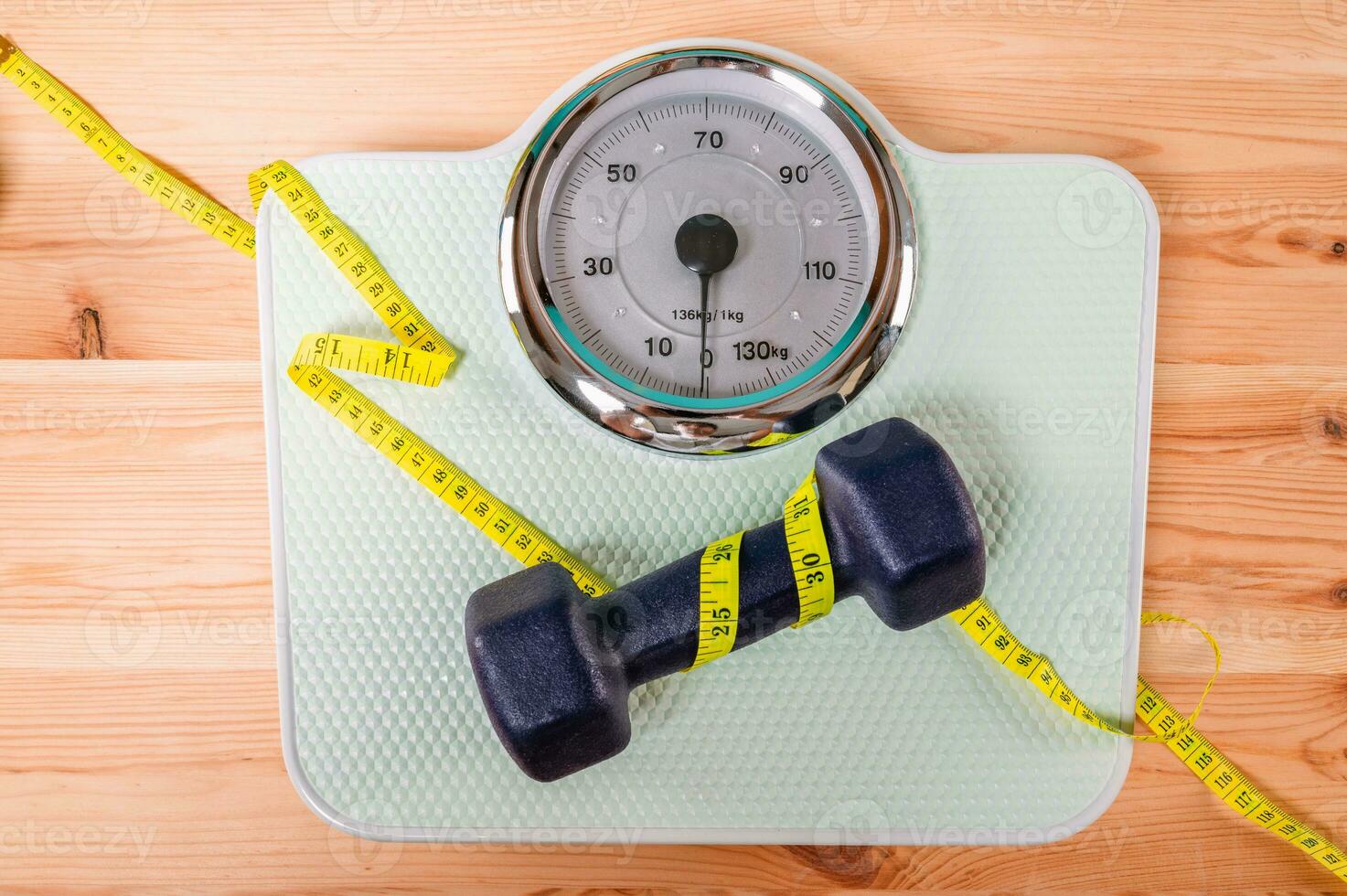 Scale for measuring weight after exercise in the gym photo