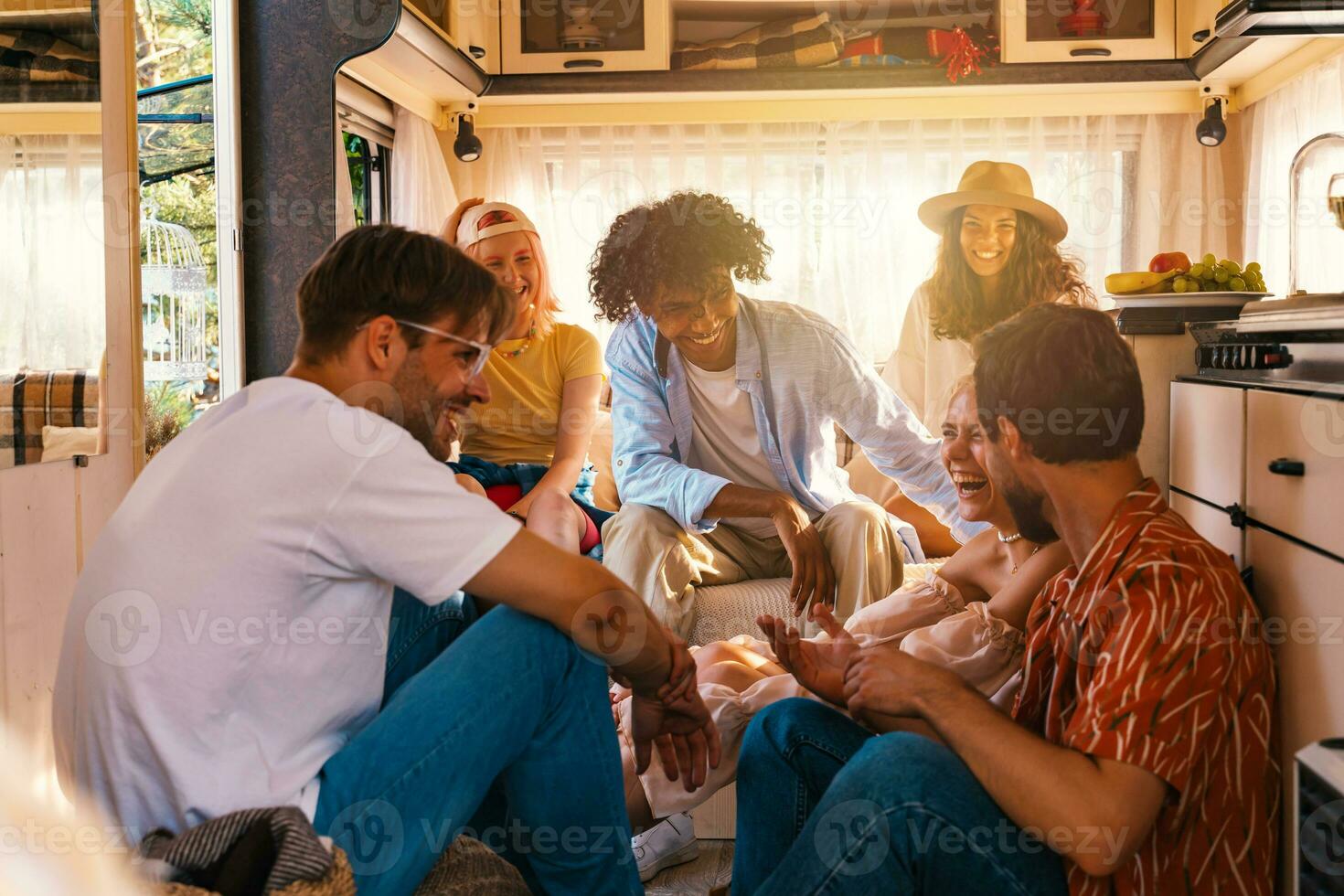 Group of happy friend have a trip with a camper photo