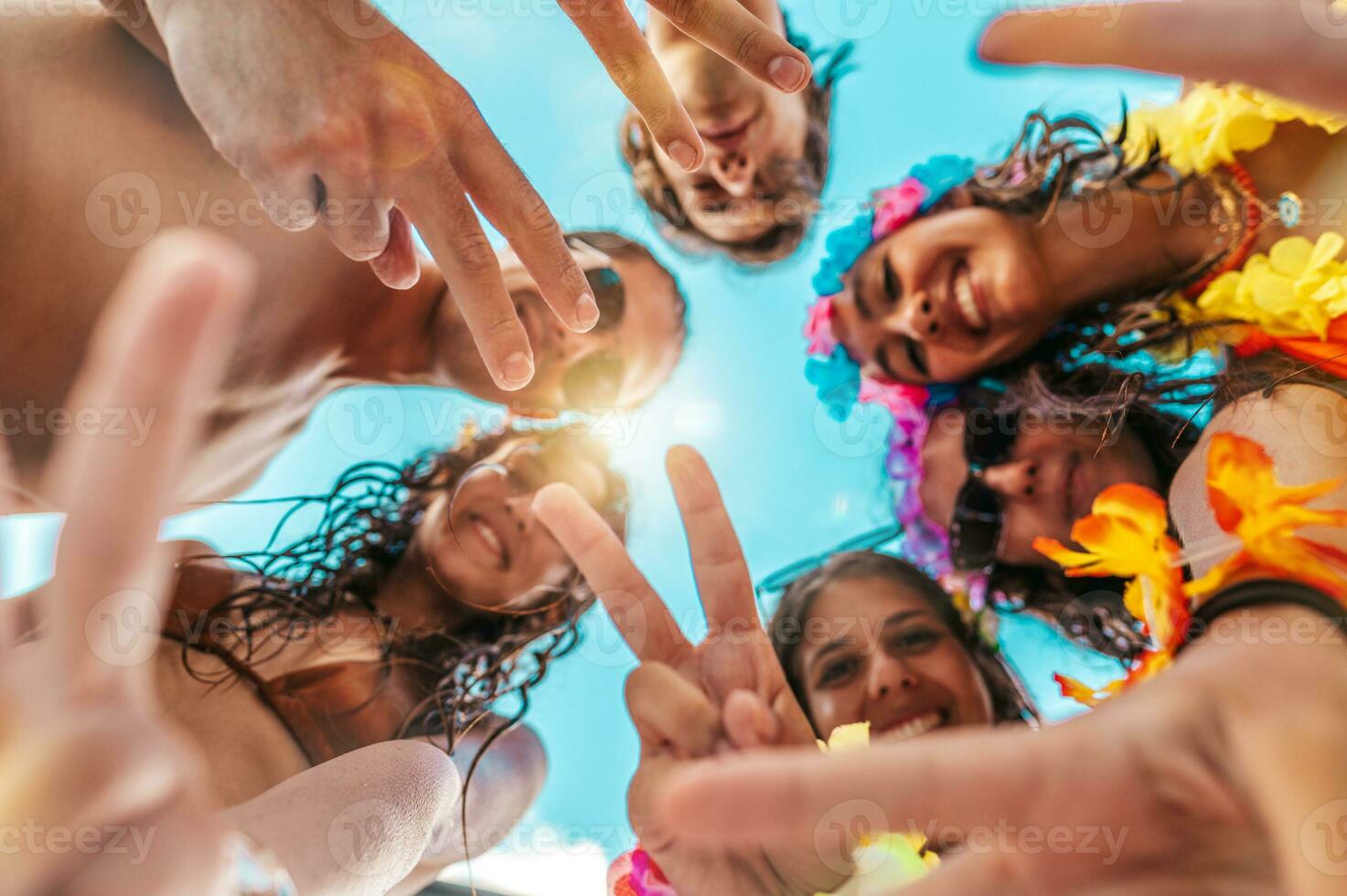 Happy smiling friend enjoy the summer at the swimmingpool photo