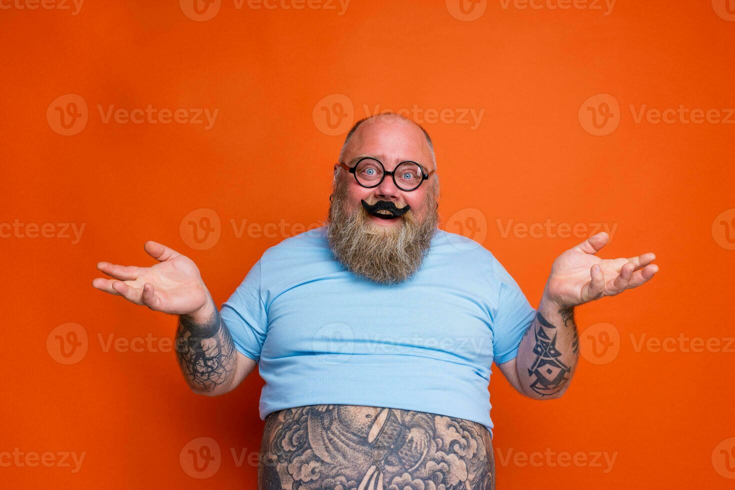 Confused fat thoughtful man acts like a nerd person photo