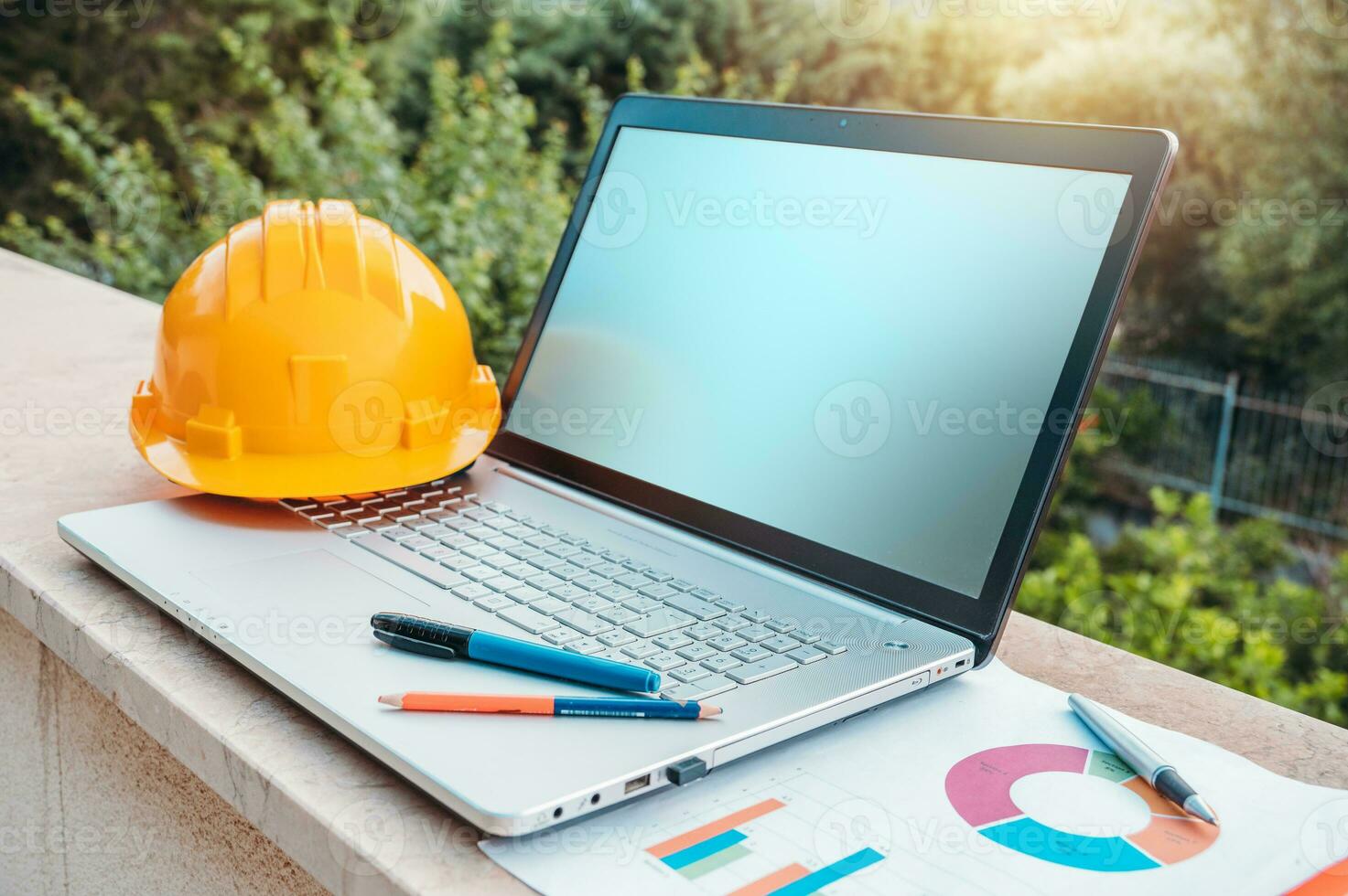 Laptop of a architect who plans a house photo