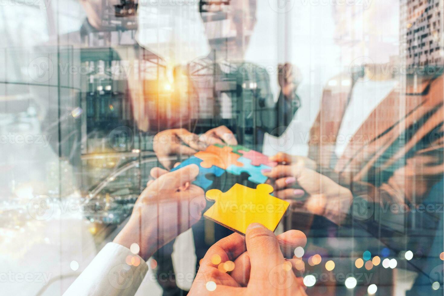 Teamwork of partners connect puzzle pieces as integration and startup photo