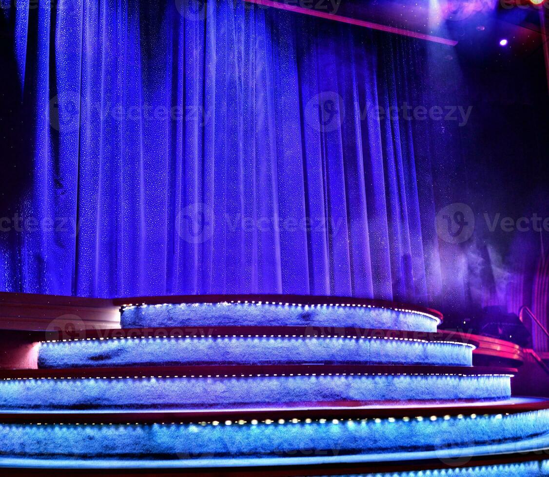 Elegant theater stage with closed blue curtain photo