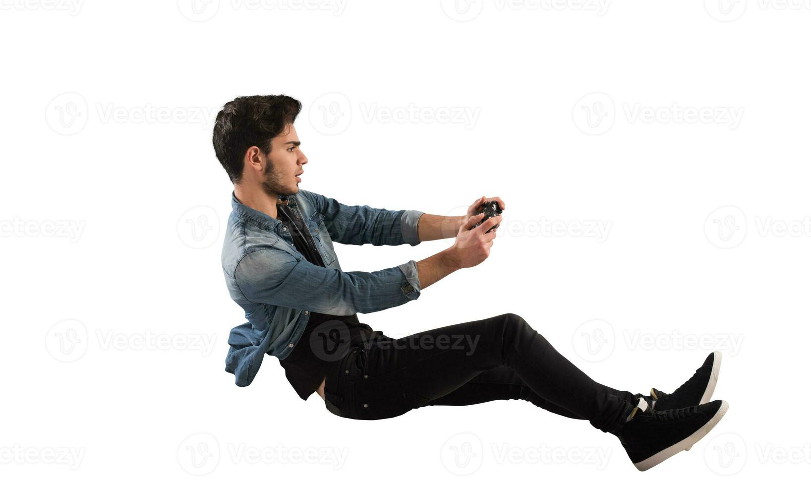 Young man with game controller plays with a video game photo