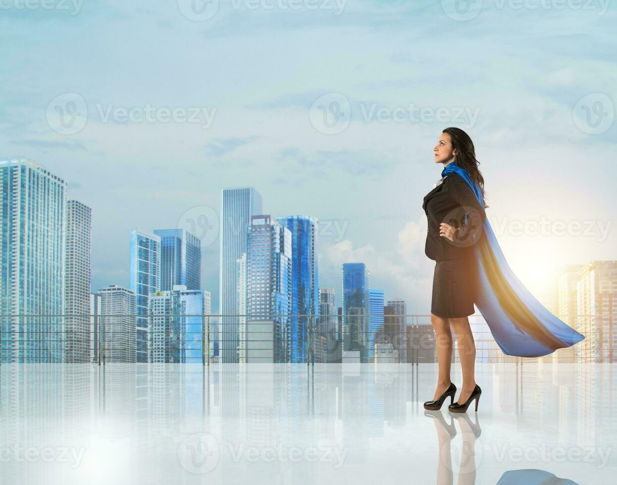 Businesswoman with a cloak acts like a super hero photo